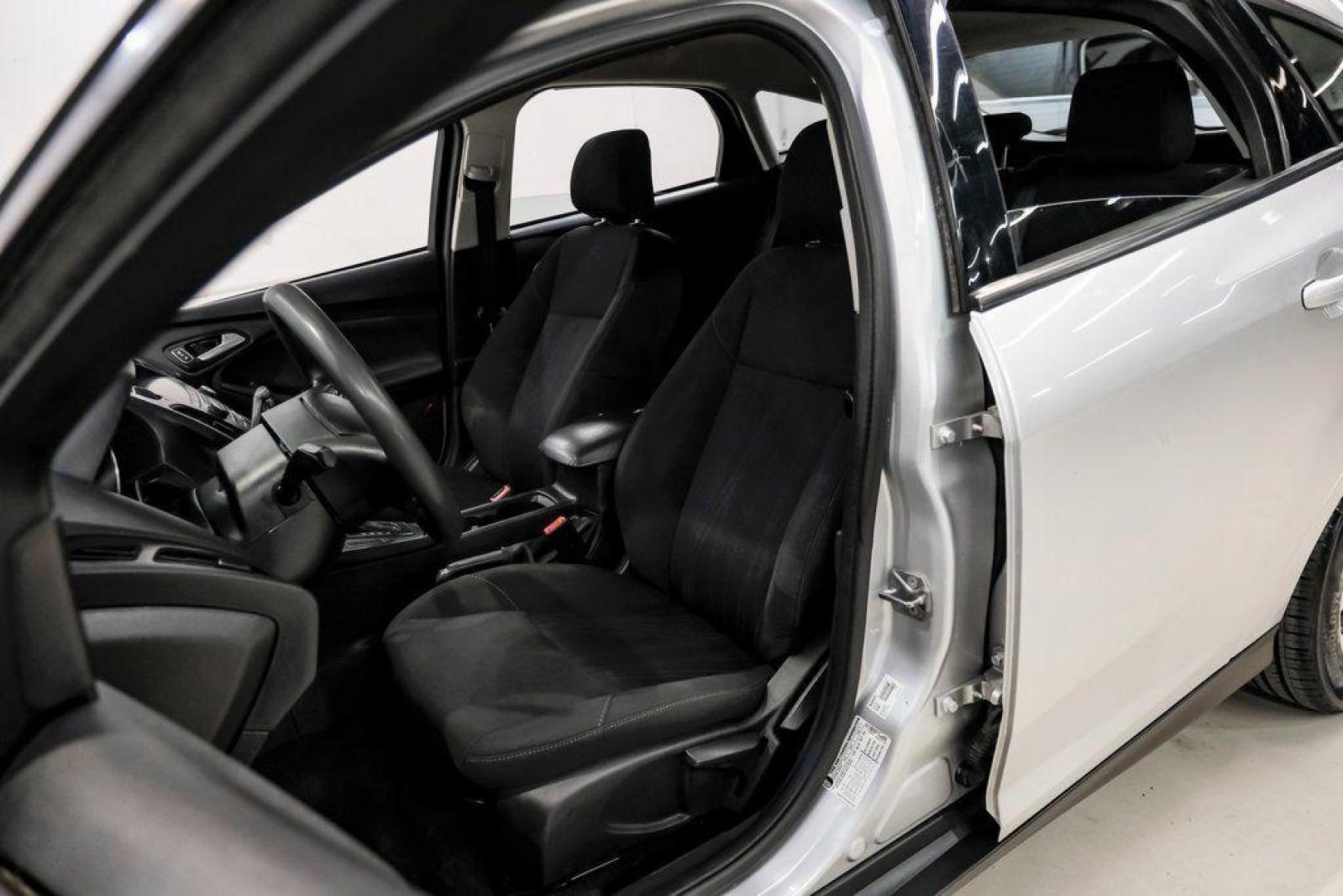 2018 Ingot Silver /Charcoal Black Ford Focus SE (1FADP3K28JL) with an 2.0L I4 DGI Ti-VCT engine, Automatic transmission, located at 15300 Midway Rd., Addison, TX, 75001, (972) 702-0011, 32.958321, -96.838074 - Photo#34