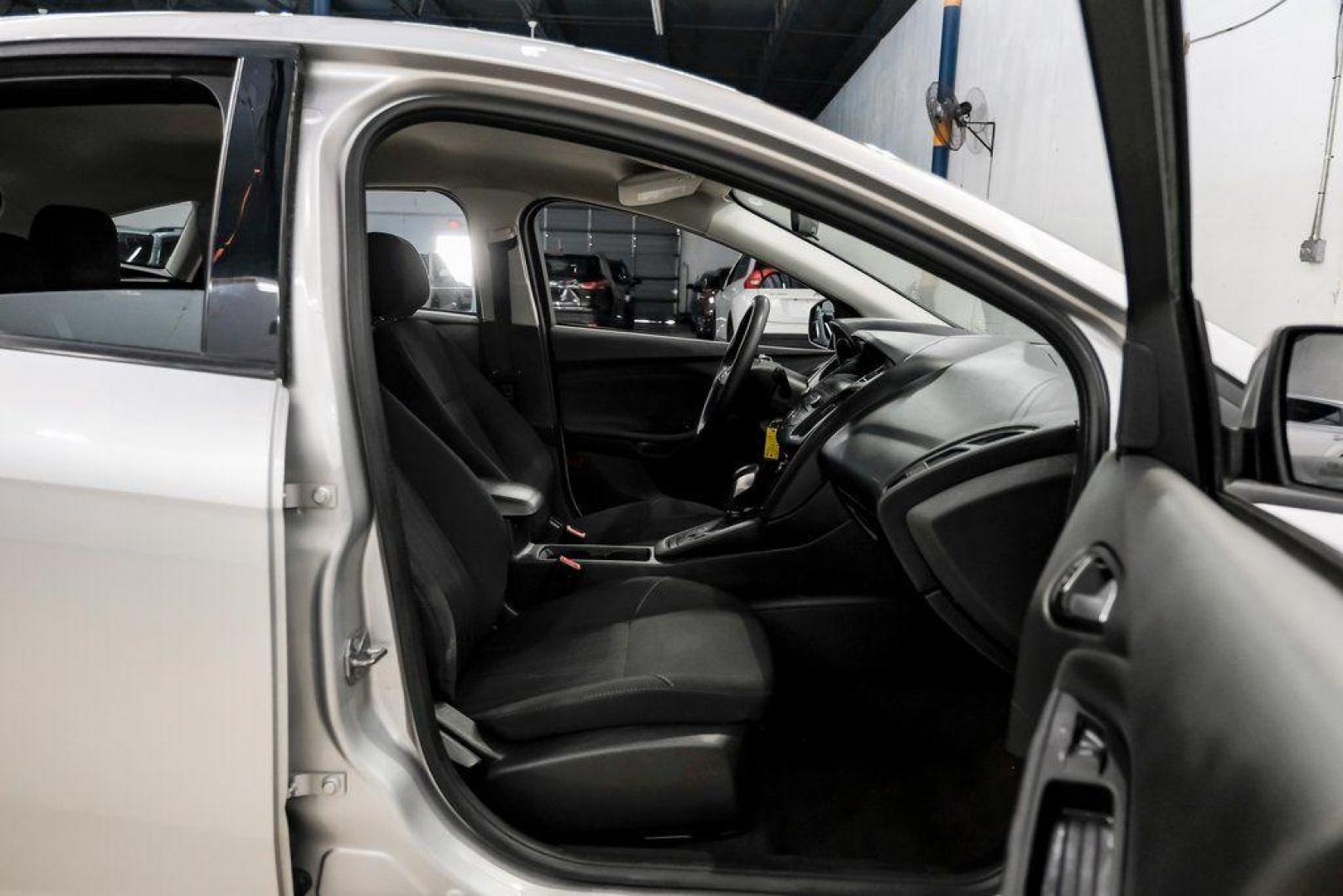 2018 Ingot Silver /Charcoal Black Ford Focus SE (1FADP3K28JL) with an 2.0L I4 DGI Ti-VCT engine, Automatic transmission, located at 15300 Midway Rd., Addison, TX, 75001, (972) 702-0011, 32.958321, -96.838074 - Photo#35