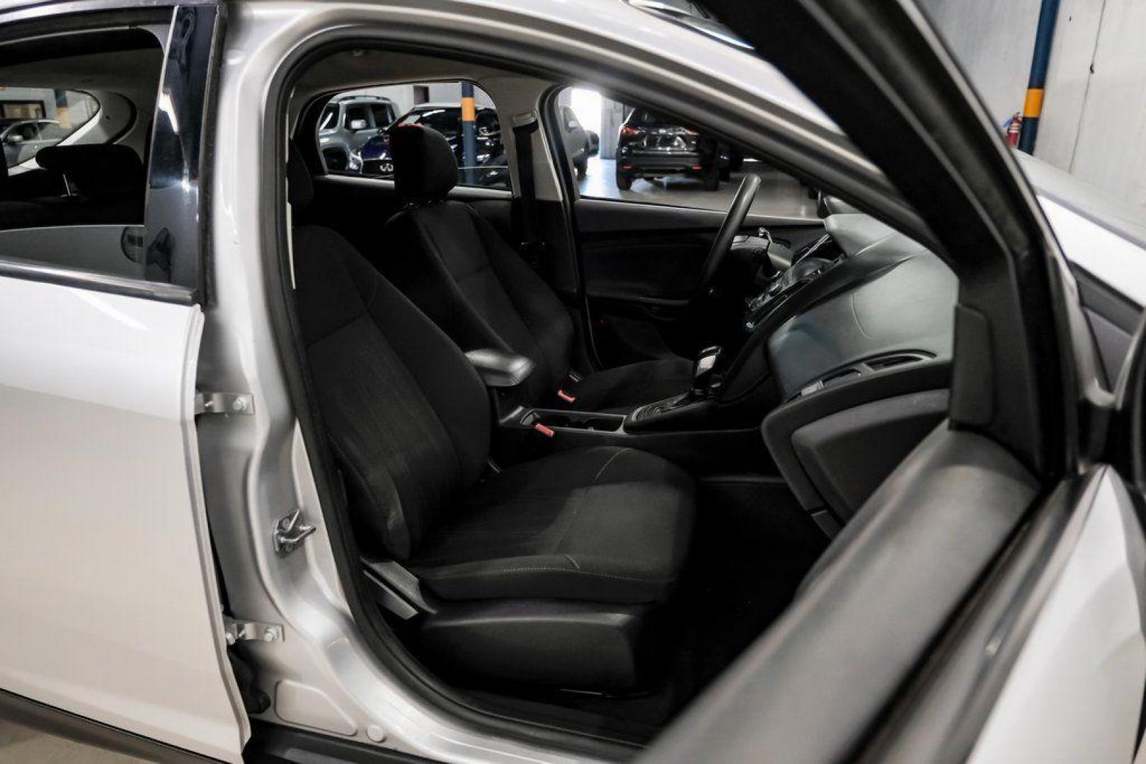 2018 Ingot Silver /Charcoal Black Ford Focus SE (1FADP3K28JL) with an 2.0L I4 DGI Ti-VCT engine, Automatic transmission, located at 15300 Midway Rd., Addison, TX, 75001, (972) 702-0011, 32.958321, -96.838074 - Photo#36