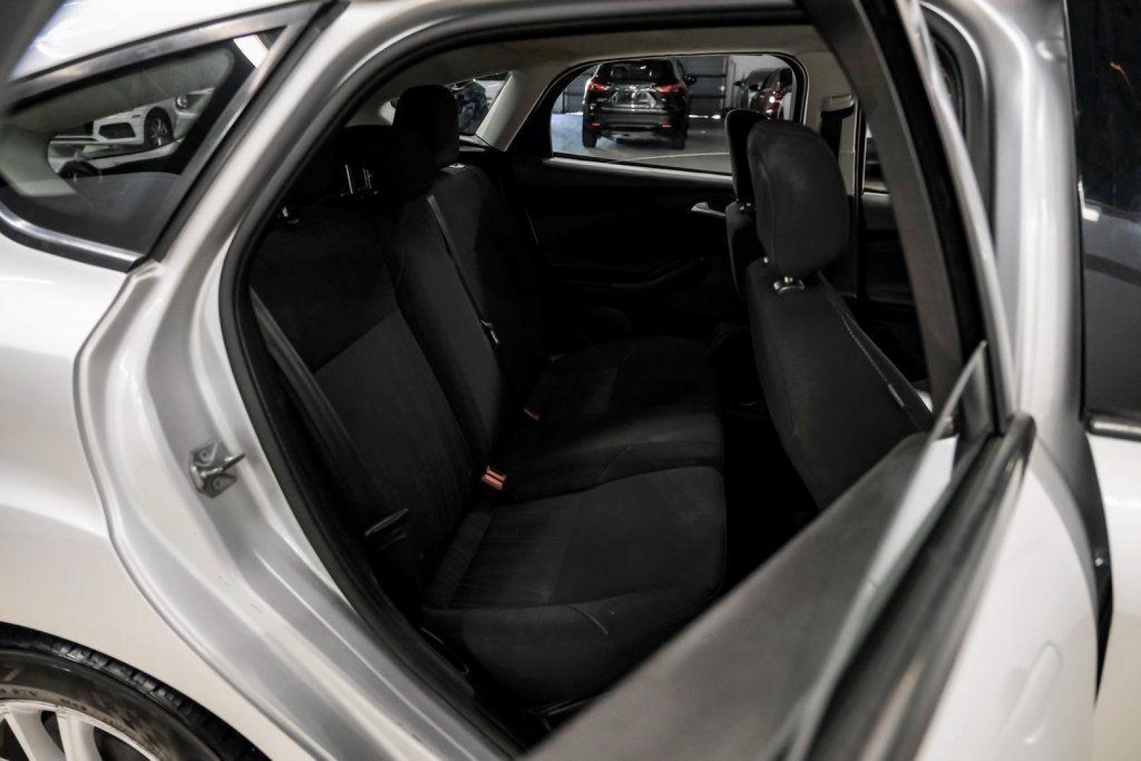 2018 Ingot Silver /Charcoal Black Ford Focus SE (1FADP3K28JL) with an 2.0L I4 DGI Ti-VCT engine, Automatic transmission, located at 15300 Midway Rd., Addison, TX, 75001, (972) 702-0011, 32.958321, -96.838074 - Photo#37