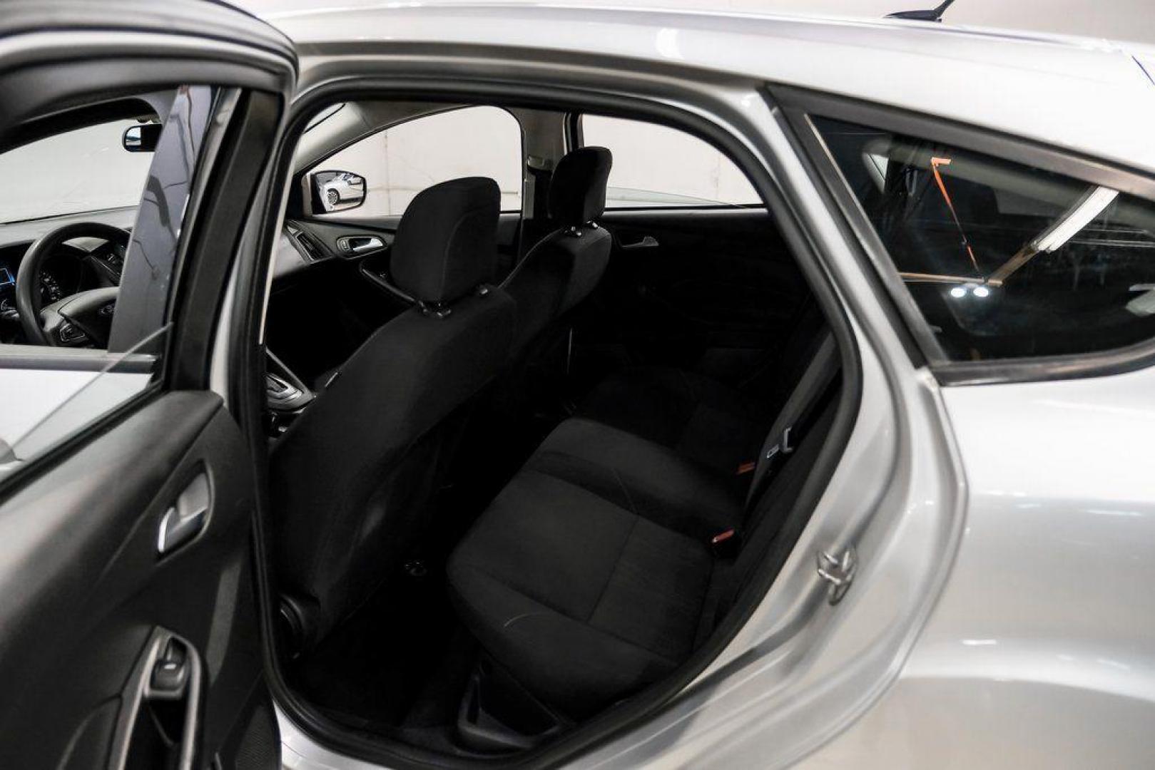 2018 Ingot Silver /Charcoal Black Ford Focus SE (1FADP3K28JL) with an 2.0L I4 DGI Ti-VCT engine, Automatic transmission, located at 15300 Midway Rd., Addison, TX, 75001, (972) 702-0011, 32.958321, -96.838074 - Photo#39