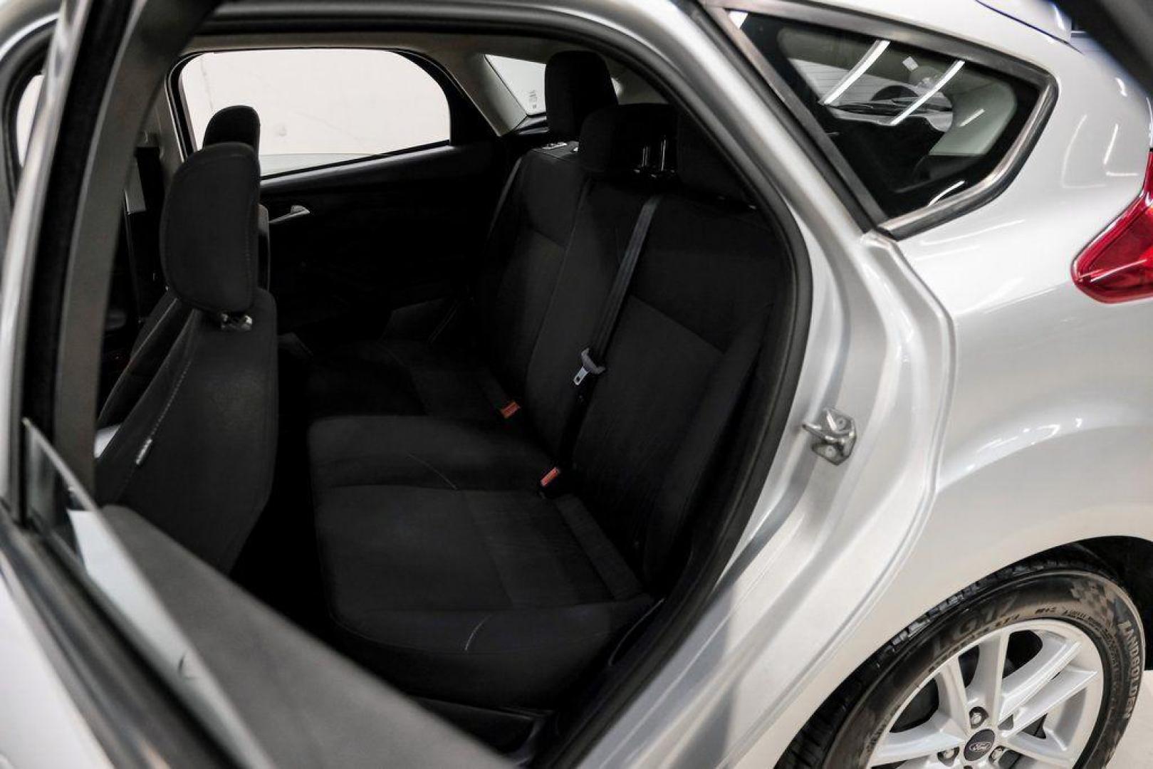 2018 Ingot Silver /Charcoal Black Ford Focus SE (1FADP3K28JL) with an 2.0L I4 DGI Ti-VCT engine, Automatic transmission, located at 15300 Midway Rd., Addison, TX, 75001, (972) 702-0011, 32.958321, -96.838074 - Photo#40