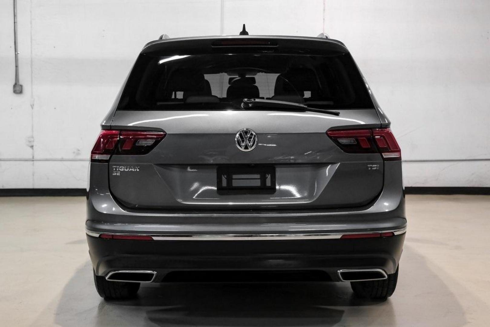 2018 Platinum Gray Metallic /White Volkswagen Tiguan 2.0T SEL (3VV3B7AX4JM) with an 2.0L TSI DOHC engine, Automatic transmission, located at 15300 Midway Rd., Addison, TX, 75001, (972) 702-0011, 32.958321, -96.838074 - Photo#10