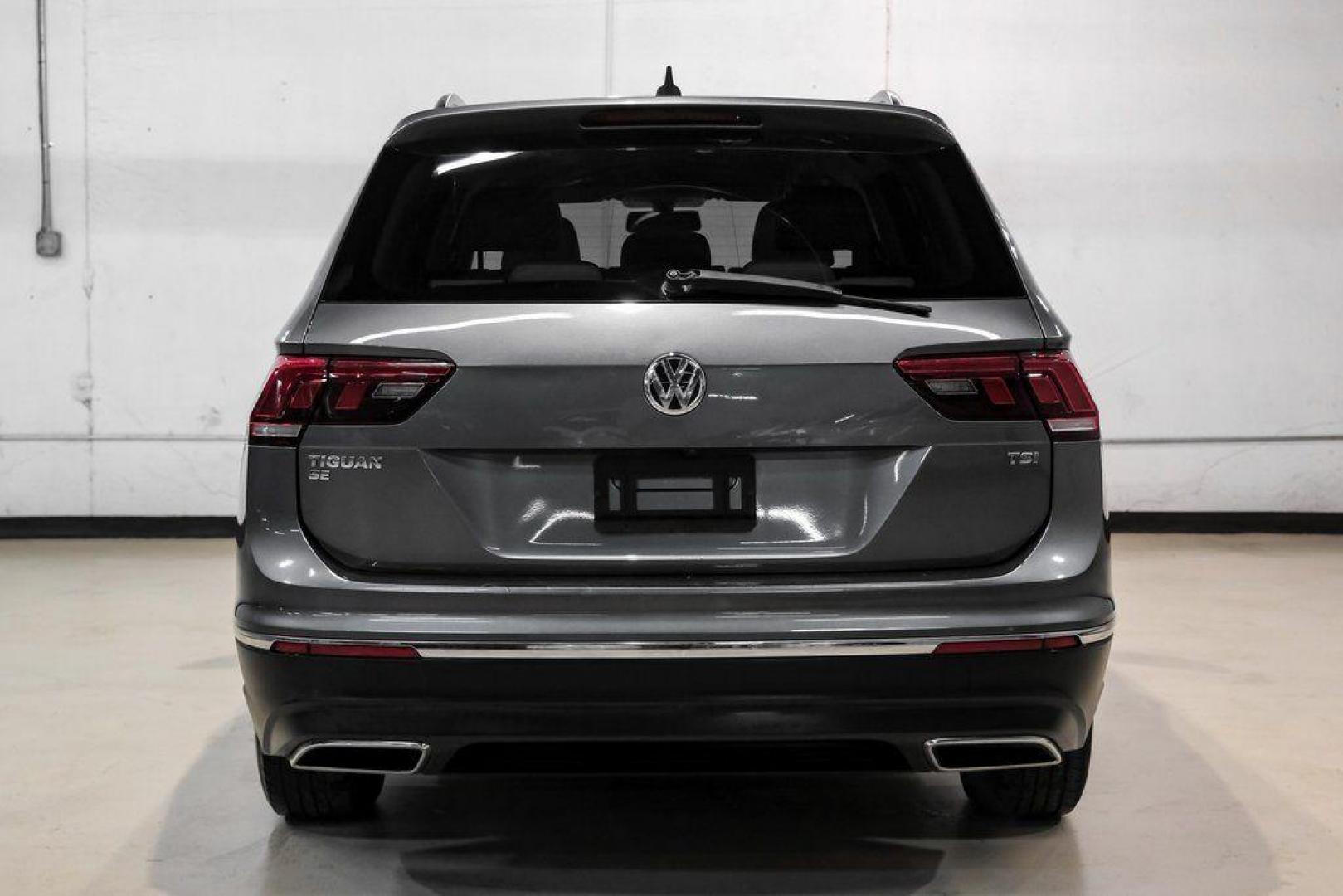 2018 Platinum Gray Metallic /White Volkswagen Tiguan 2.0T SEL (3VV3B7AX4JM) with an 2.0L TSI DOHC engine, Automatic transmission, located at 15300 Midway Rd., Addison, TX, 75001, (972) 702-0011, 32.958321, -96.838074 - Photo#10