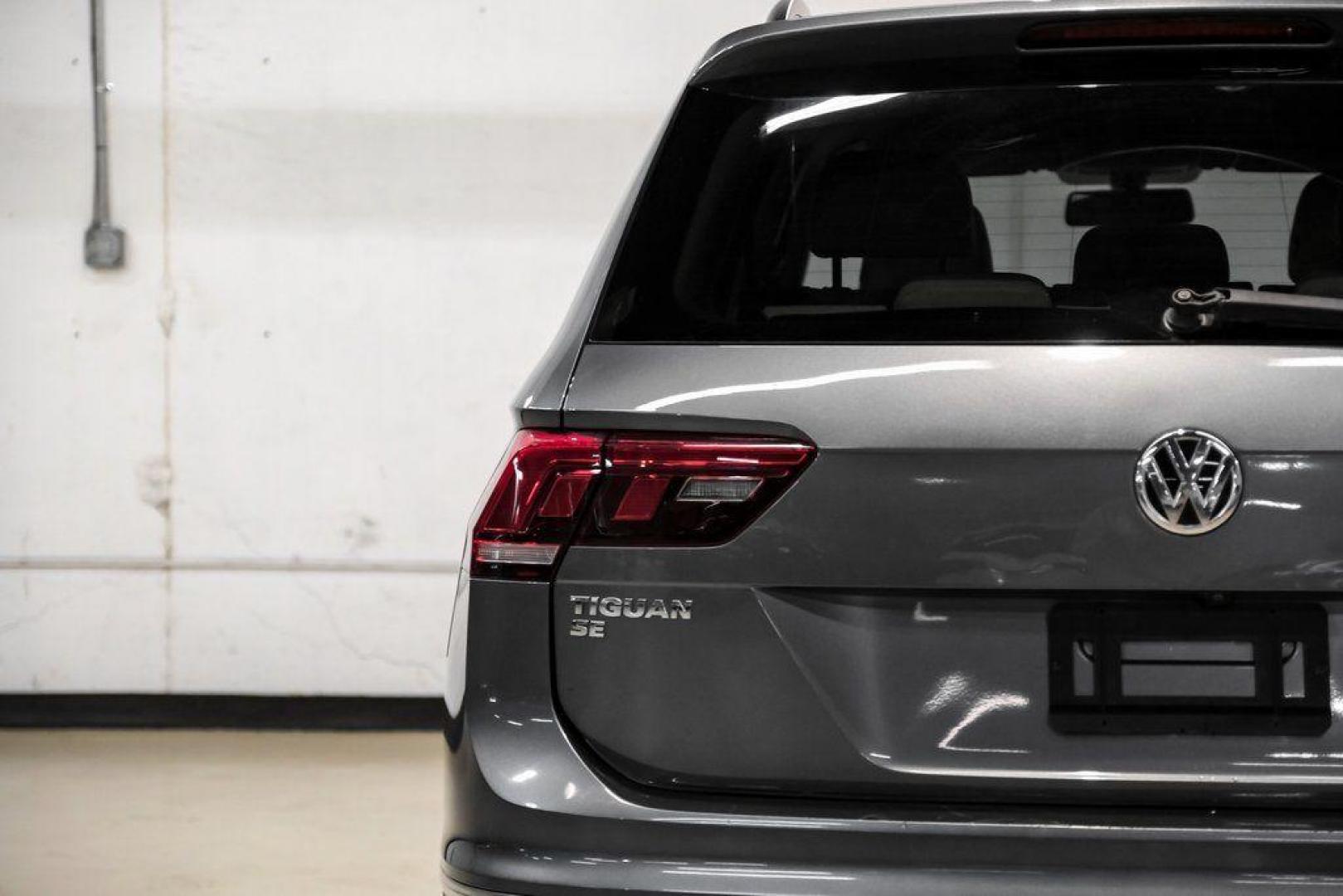 2018 Platinum Gray Metallic /White Volkswagen Tiguan 2.0T SEL (3VV3B7AX4JM) with an 2.0L TSI DOHC engine, Automatic transmission, located at 15300 Midway Rd., Addison, TX, 75001, (972) 702-0011, 32.958321, -96.838074 - Photo#49