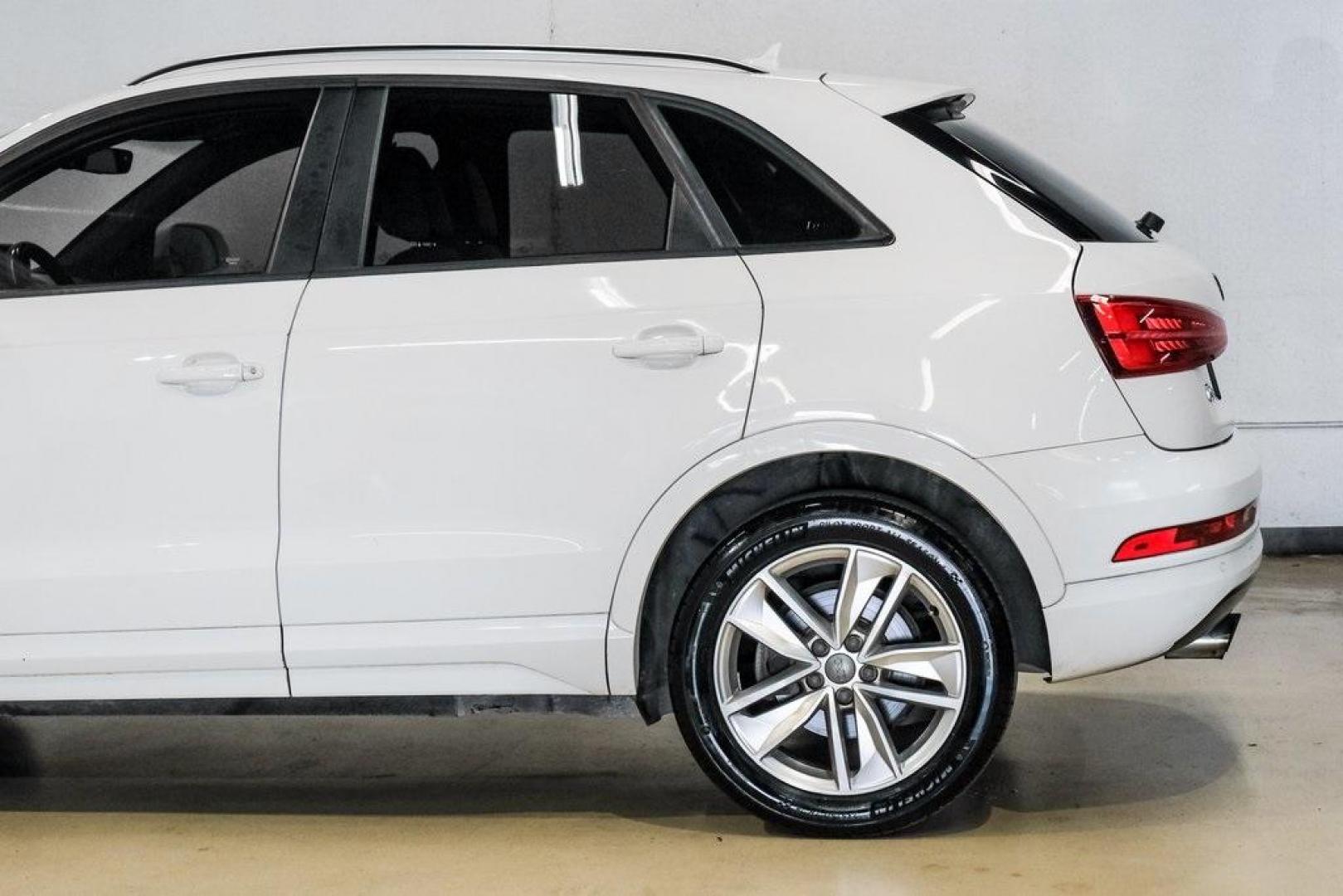 2018 White /Black Audi Q3 2.0T Premium (WA1BCCFS0JR) with an 2.0L 4-Cylinder TFSI engine, Automatic transmission, located at 15300 Midway Rd., Addison, TX, 75001, (972) 702-0011, 32.958321, -96.838074 - Photo#17