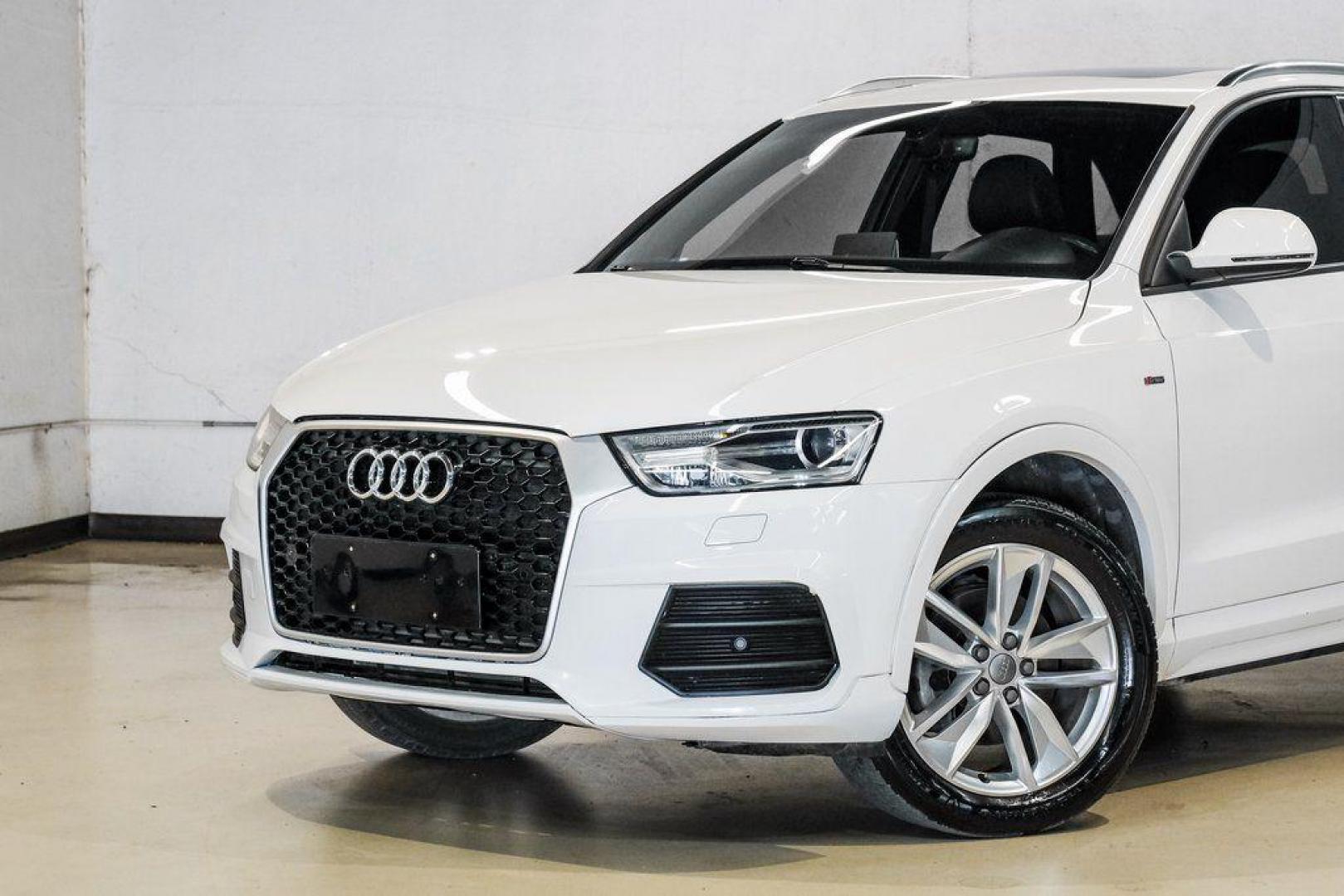 2018 White /Black Audi Q3 2.0T Premium (WA1BCCFS0JR) with an 2.0L 4-Cylinder TFSI engine, Automatic transmission, located at 15300 Midway Rd., Addison, TX, 75001, (972) 702-0011, 32.958321, -96.838074 - Photo#5
