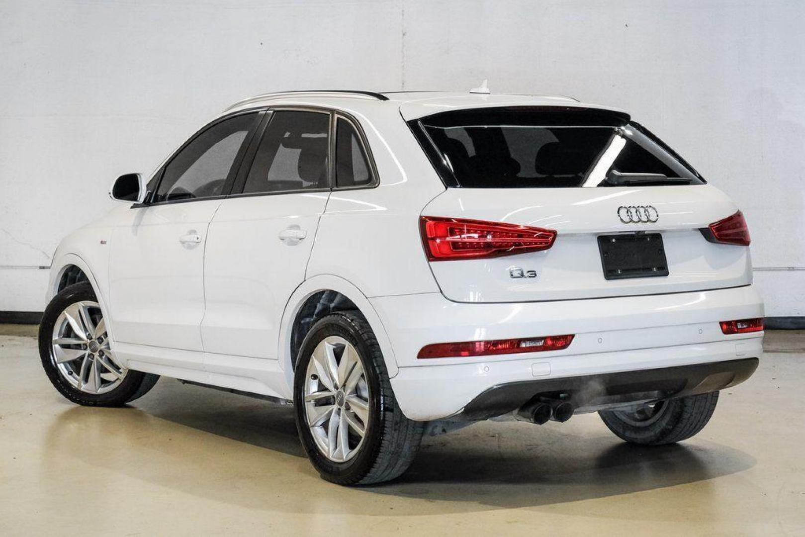 2018 White /Black Audi Q3 2.0T Premium (WA1BCCFS0JR) with an 2.0L 4-Cylinder TFSI engine, Automatic transmission, located at 15300 Midway Rd., Addison, TX, 75001, (972) 702-0011, 32.958321, -96.838074 - Photo#12