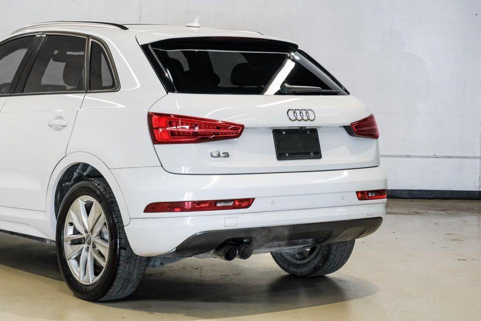 2018 White /Black Audi Q3 2.0T Premium (WA1BCCFS0JR) with an 2.0L 4-Cylinder TFSI engine, Automatic transmission, located at 15300 Midway Rd., Addison, TX, 75001, (972) 702-0011, 32.958321, -96.838074 - Photo#14
