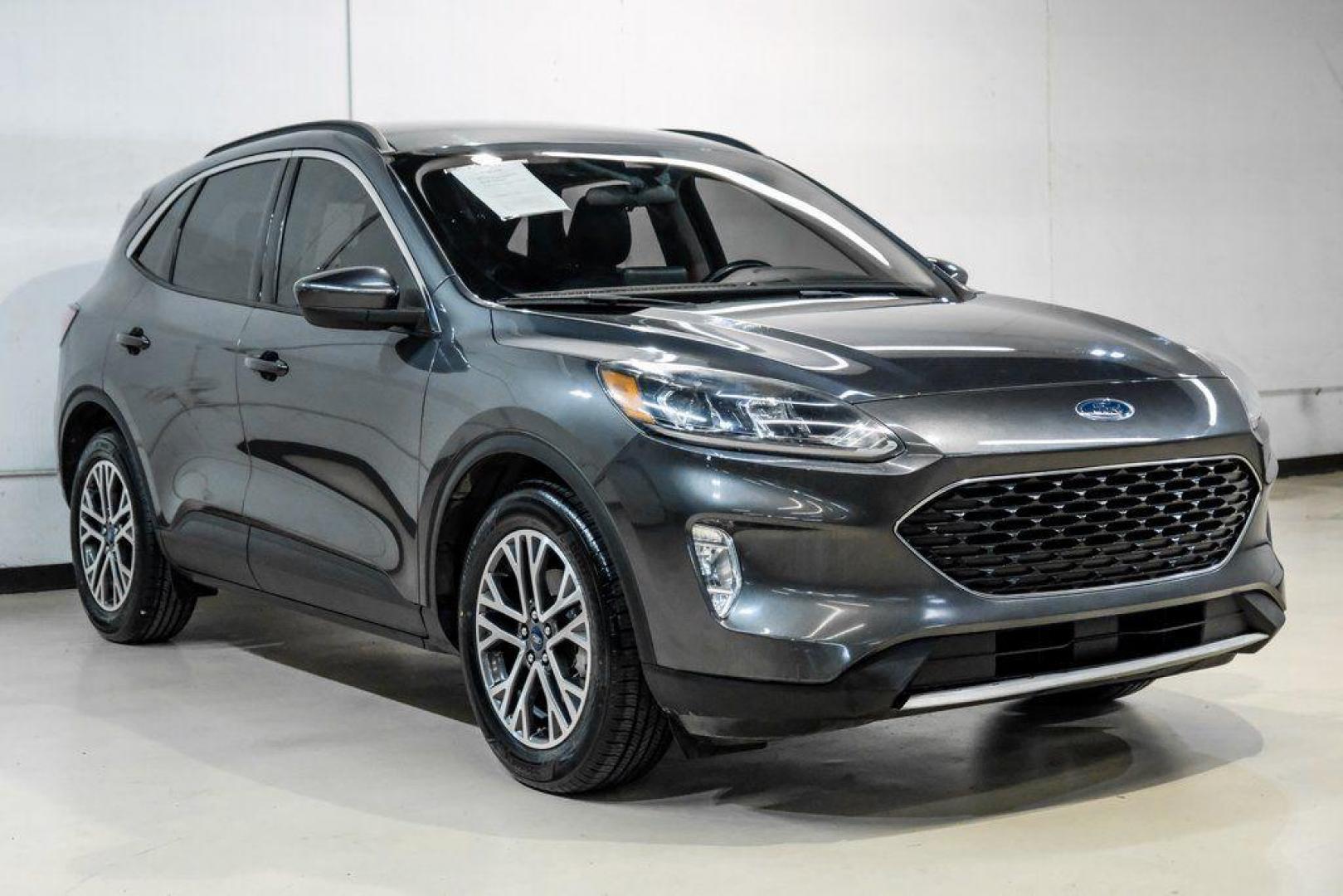 2020 Magnetic /Ebony Ford Escape SEL (1FMCU0H62LU) with an 1.5L EcoBoost engine, Automatic transmission, located at 15300 Midway Rd., Addison, TX, 75001, (972) 702-0011, 32.958321, -96.838074 - Photo#5