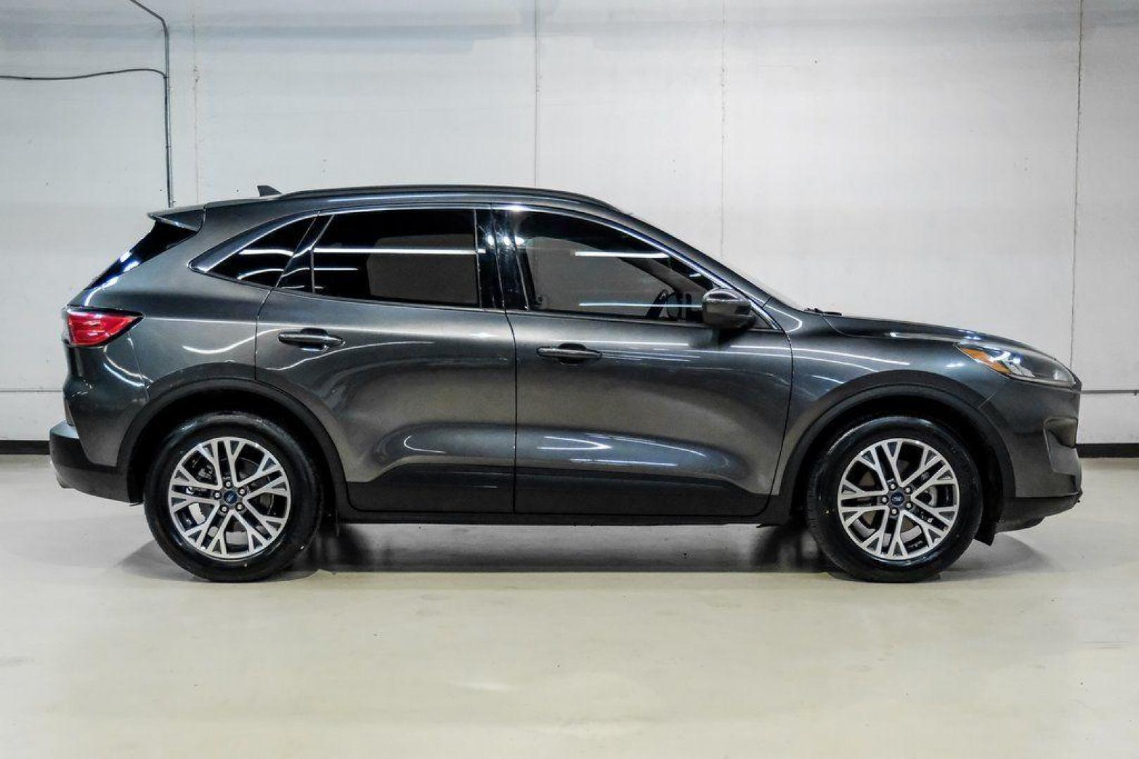 2020 Magnetic /Ebony Ford Escape SEL (1FMCU0H62LU) with an 1.5L EcoBoost engine, Automatic transmission, located at 15300 Midway Rd., Addison, TX, 75001, (972) 702-0011, 32.958321, -96.838074 - Photo#6