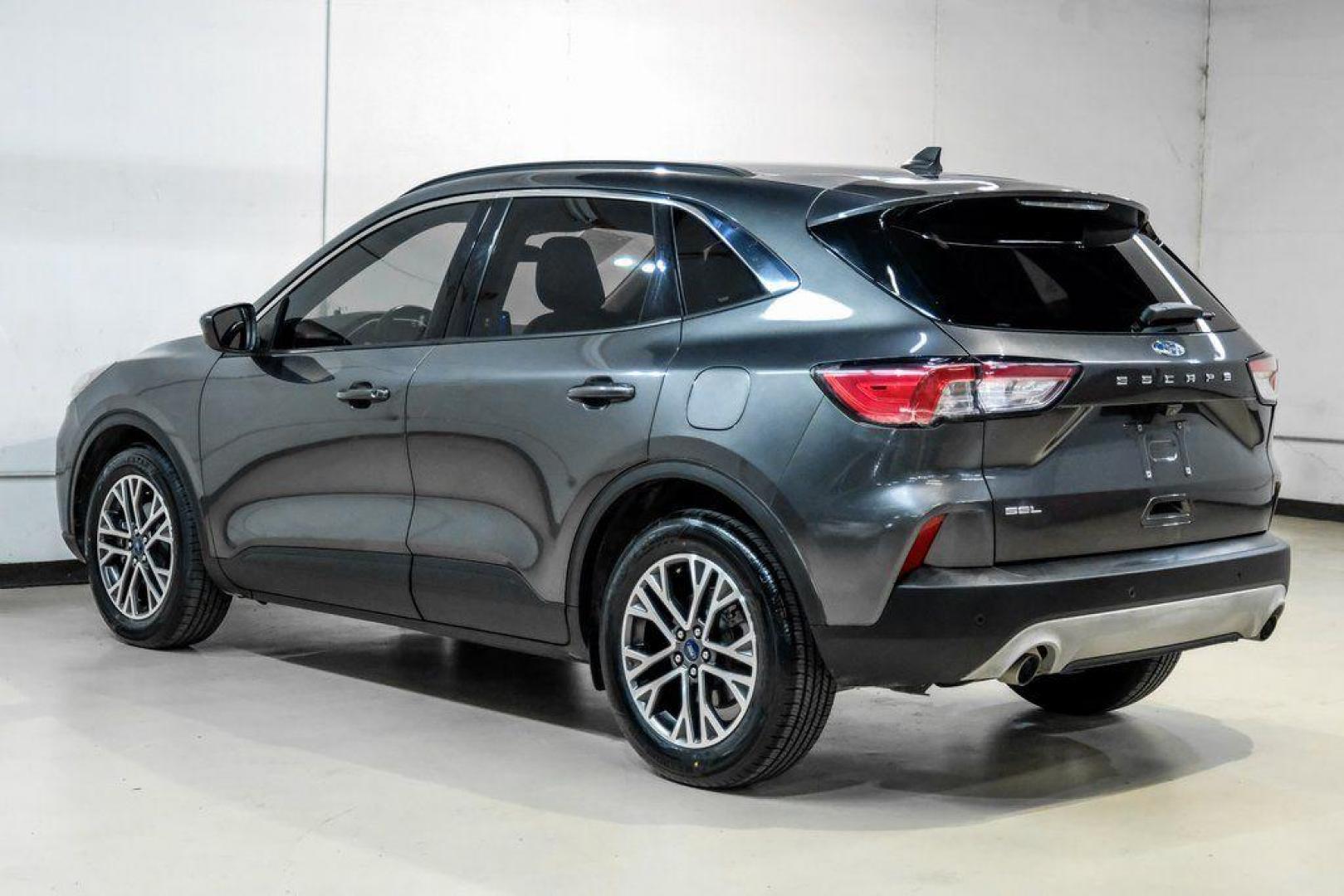 2020 Magnetic /Ebony Ford Escape SEL (1FMCU0H62LU) with an 1.5L EcoBoost engine, Automatic transmission, located at 15300 Midway Rd., Addison, TX, 75001, (972) 702-0011, 32.958321, -96.838074 - Photo#9