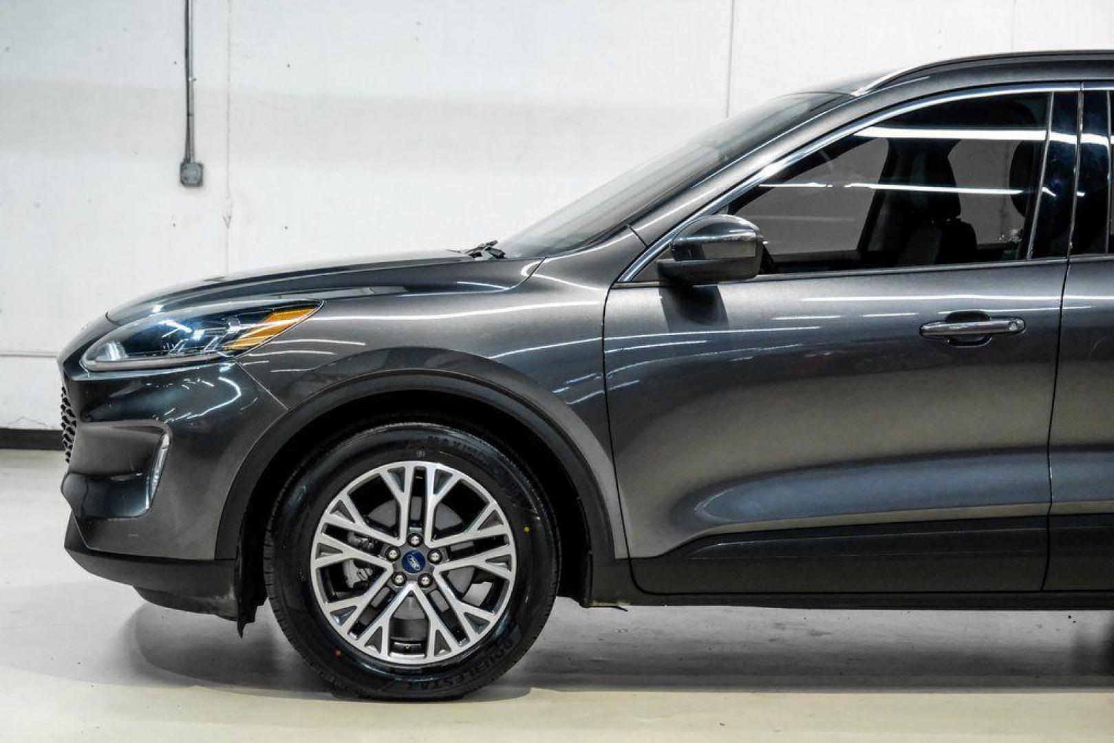 2020 Magnetic /Ebony Ford Escape SEL (1FMCU0H62LU) with an 1.5L EcoBoost engine, Automatic transmission, located at 15300 Midway Rd., Addison, TX, 75001, (972) 702-0011, 32.958321, -96.838074 - Photo#11