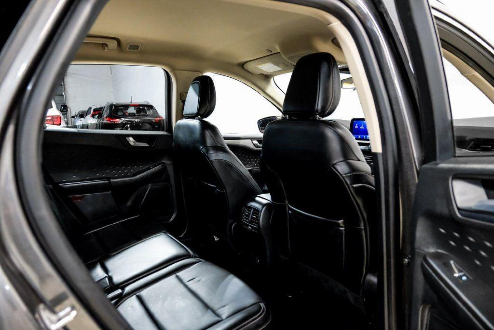 2020 Magnetic /Ebony Ford Escape SEL (1FMCU0H62LU) with an 1.5L EcoBoost engine, Automatic transmission, located at 15300 Midway Rd., Addison, TX, 75001, (972) 702-0011, 32.958321, -96.838074 - Photo#35