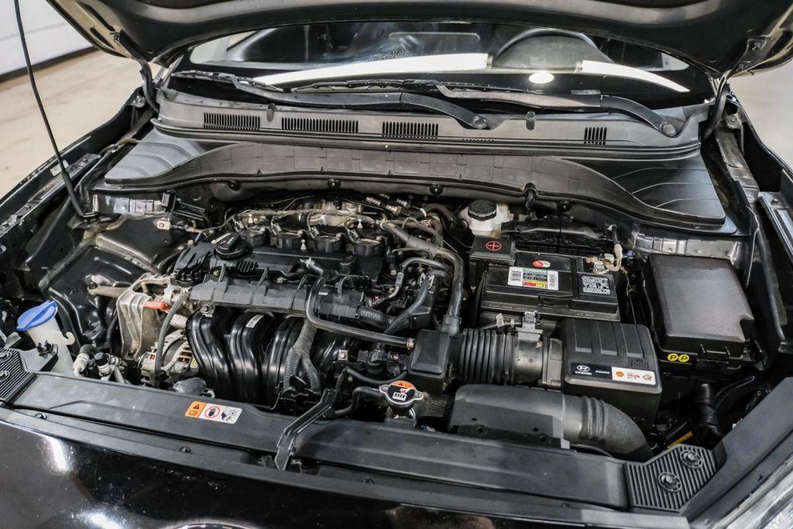 2022 Ultra Black /Black Hyundai Kona SEL (KM8K62AB1NU) with an 2.0L I4 MPI DOHC 16V LEV3-ULEV70 147hp engine, CVT transmission, located at 15300 Midway Rd., Addison, TX, 75001, (972) 702-0011, 32.958321, -96.838074 - Photo#46