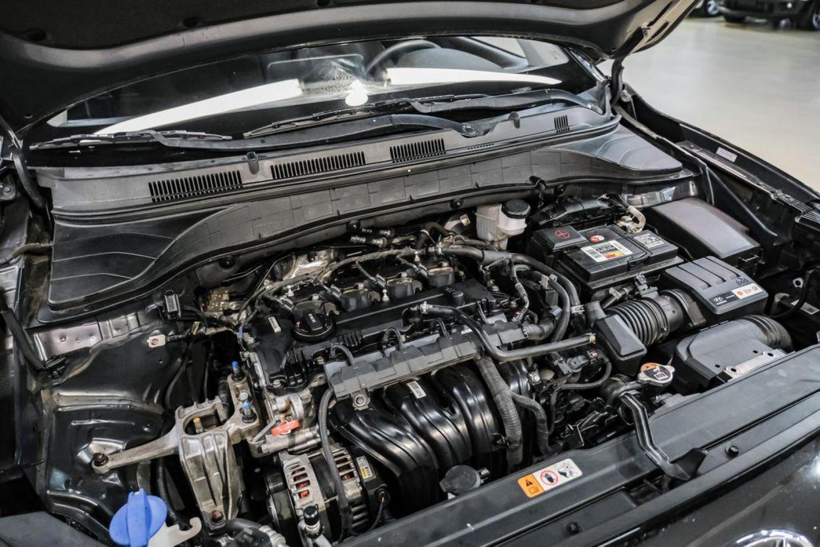 2022 Ultra Black /Black Hyundai Kona SEL (KM8K62AB1NU) with an 2.0L I4 MPI DOHC 16V LEV3-ULEV70 147hp engine, CVT transmission, located at 15300 Midway Rd., Addison, TX, 75001, (972) 702-0011, 32.958321, -96.838074 - Photo#48