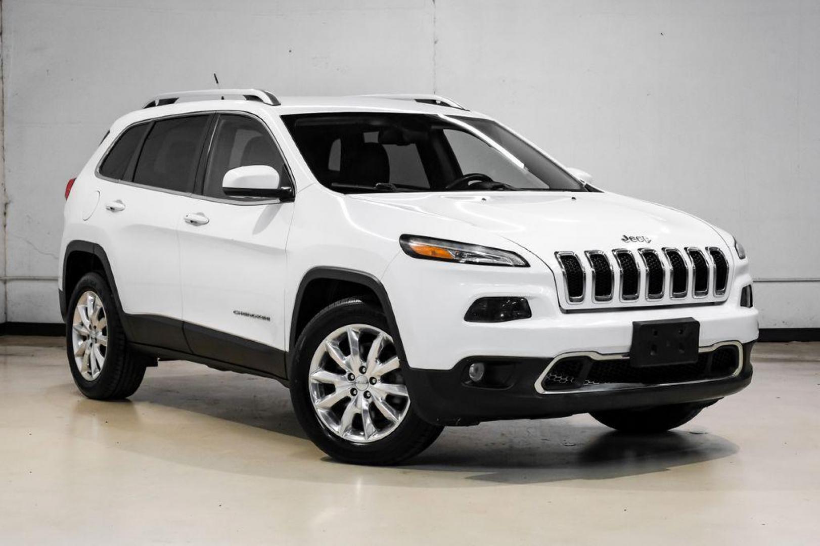2015 Bright White Clearcoat /Indigo Blue/Brown Jeep Cherokee Limited (1C4PJMDS3FW) with an 3.2L V6 engine, Automatic transmission, located at 15300 Midway Rd., Addison, TX, 75001, (972) 702-0011, 32.958321, -96.838074 - Photo#7