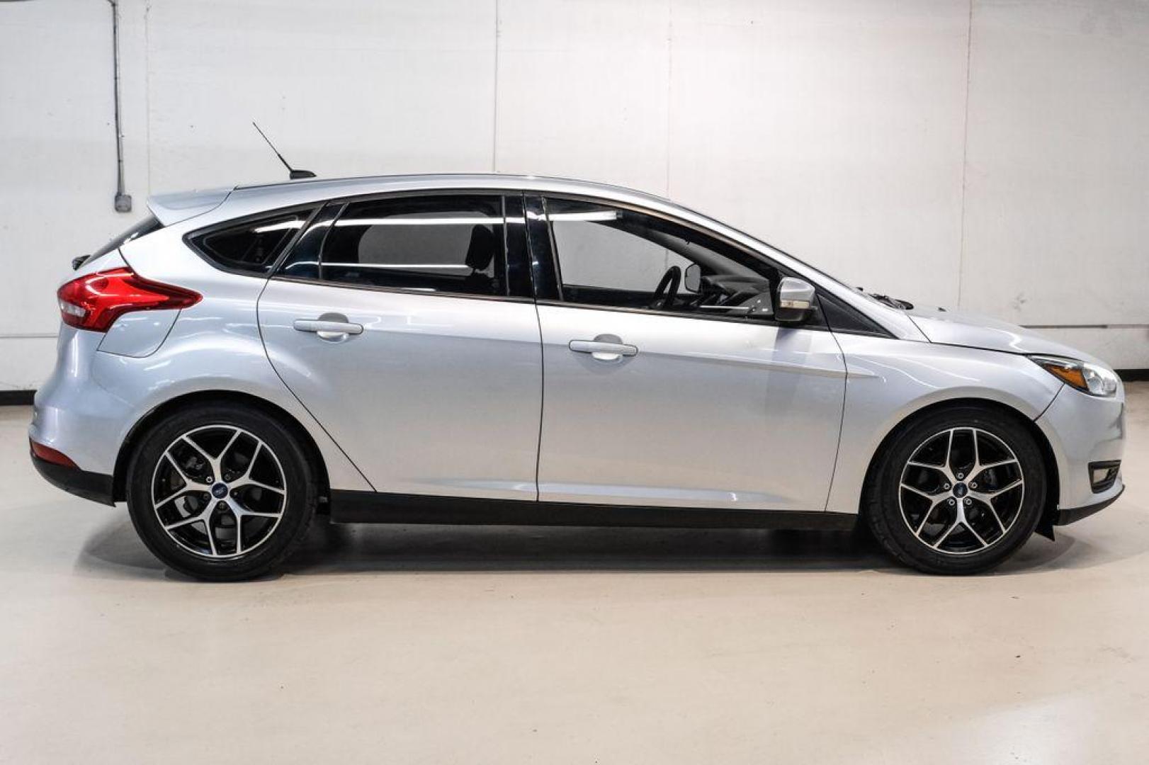 2017 Ingot Silver /Black Ford Focus SEL (1FADP3M23HL) with an 2.0L I4 GDI Ti-VCT Flex Fuel engine, Automatic transmission, located at 15300 Midway Rd., Addison, TX, 75001, (972) 702-0011, 32.958321, -96.838074 - Photo#7