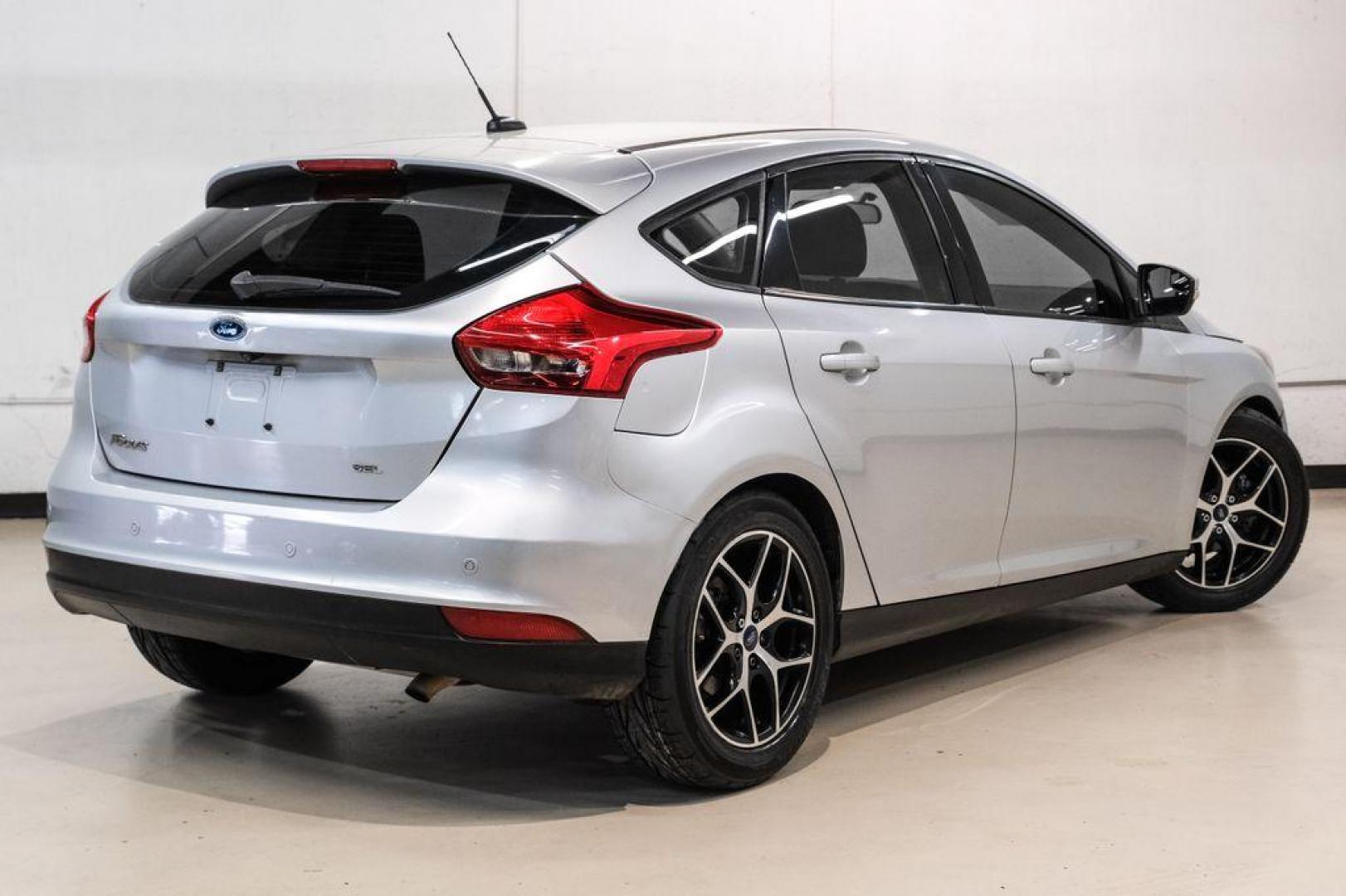 2017 Ingot Silver /Black Ford Focus SEL (1FADP3M23HL) with an 2.0L I4 GDI Ti-VCT Flex Fuel engine, Automatic transmission, located at 15300 Midway Rd., Addison, TX, 75001, (972) 702-0011, 32.958321, -96.838074 - Photo#8