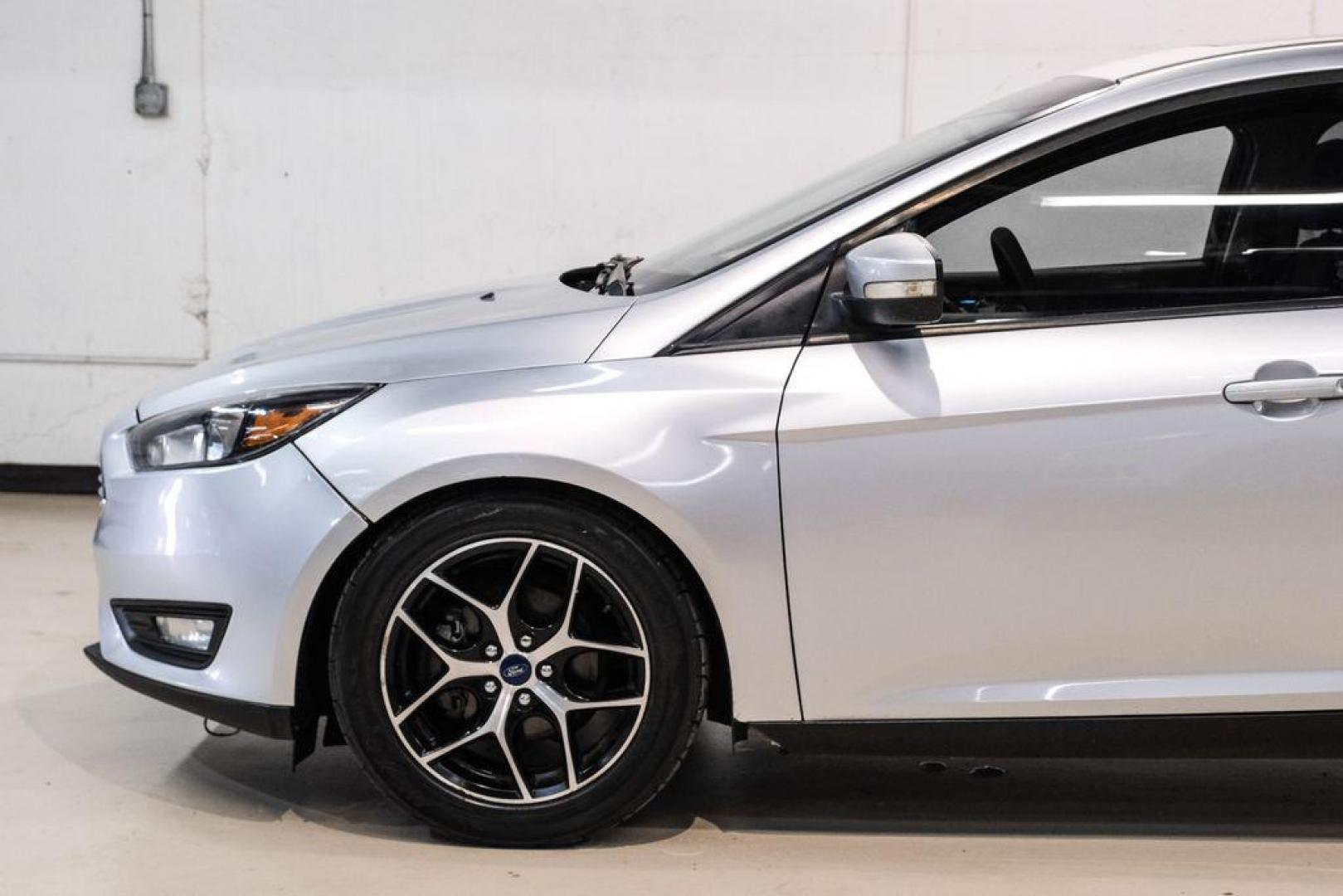2017 Ingot Silver /Black Ford Focus SEL (1FADP3M23HL) with an 2.0L I4 GDI Ti-VCT Flex Fuel engine, Automatic transmission, located at 15300 Midway Rd., Addison, TX, 75001, (972) 702-0011, 32.958321, -96.838074 - Photo#12