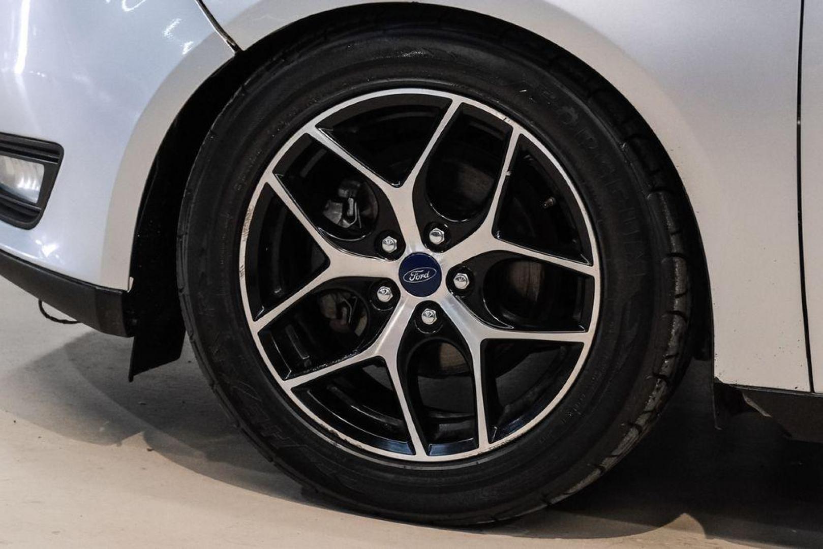 2017 Ingot Silver /Black Ford Focus SEL (1FADP3M23HL) with an 2.0L I4 GDI Ti-VCT Flex Fuel engine, Automatic transmission, located at 15300 Midway Rd., Addison, TX, 75001, (972) 702-0011, 32.958321, -96.838074 - Photo#49