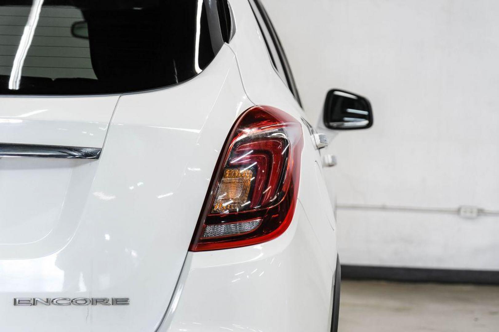 2020 Summit White /Ebony Buick Encore Preferred (KL4CJASB8LB) with an ECOTEC 1.4L I4 SMPI DOHC Turbocharged VVT engine, Automatic transmission, located at 15300 Midway Rd., Addison, TX, 75001, (972) 702-0011, 32.958321, -96.838074 - Photo#48