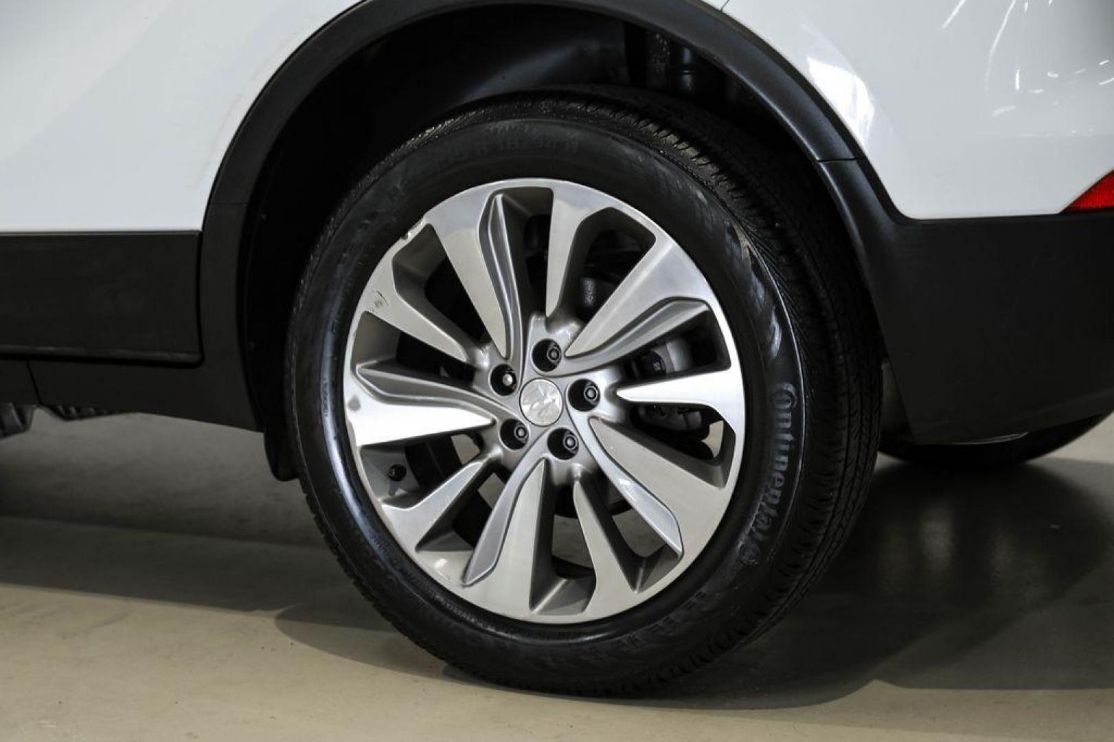 2020 Summit White /Ebony Buick Encore Preferred (KL4CJASB8LB) with an ECOTEC 1.4L I4 SMPI DOHC Turbocharged VVT engine, Automatic transmission, located at 15300 Midway Rd., Addison, TX, 75001, (972) 702-0011, 32.958321, -96.838074 - Photo#57