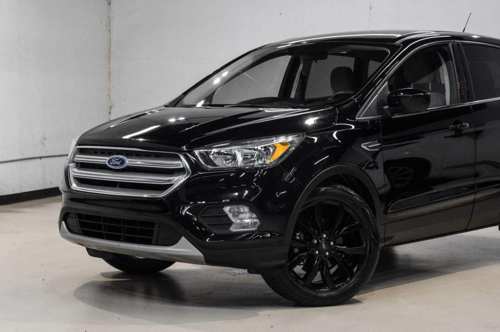 2019 Black /Medium Light Stone Ford Escape SE (1FMCU0GD2KU) with an 1.5L EcoBoost engine, Automatic transmission, located at 15300 Midway Rd., Addison, TX, 75001, (972) 702-0011, 32.958321, -96.838074 - Photo#4