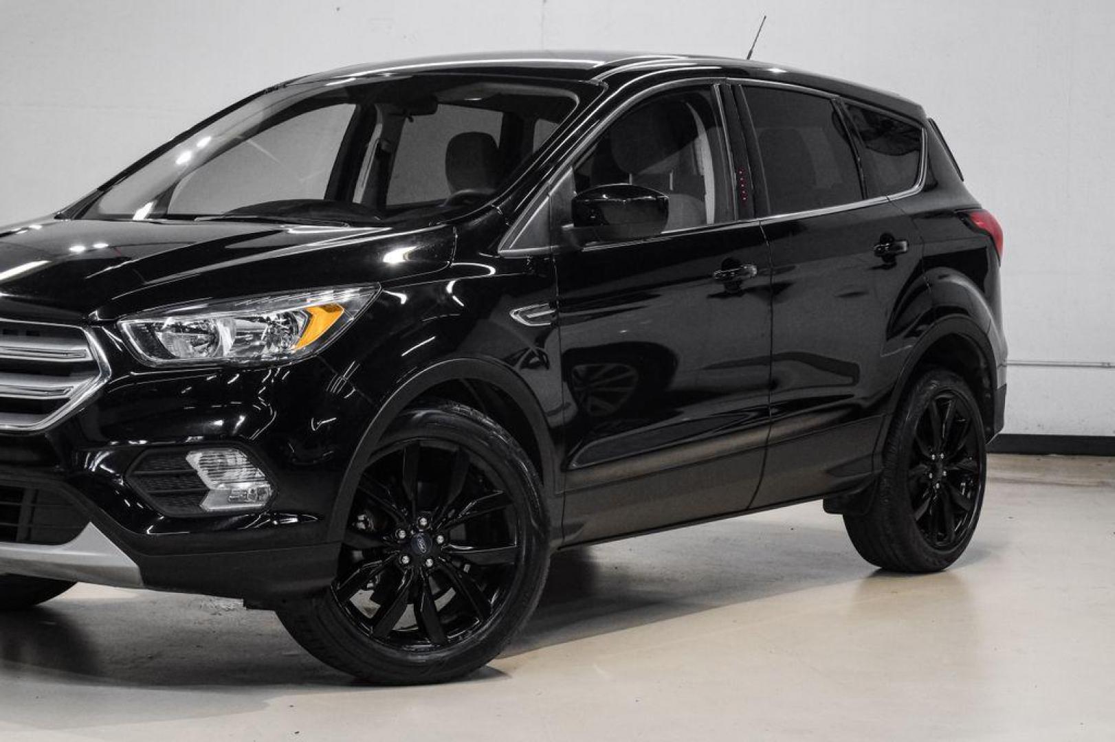 2019 Black /Medium Light Stone Ford Escape SE (1FMCU0GD2KU) with an 1.5L EcoBoost engine, Automatic transmission, located at 15300 Midway Rd., Addison, TX, 75001, (972) 702-0011, 32.958321, -96.838074 - Photo#5