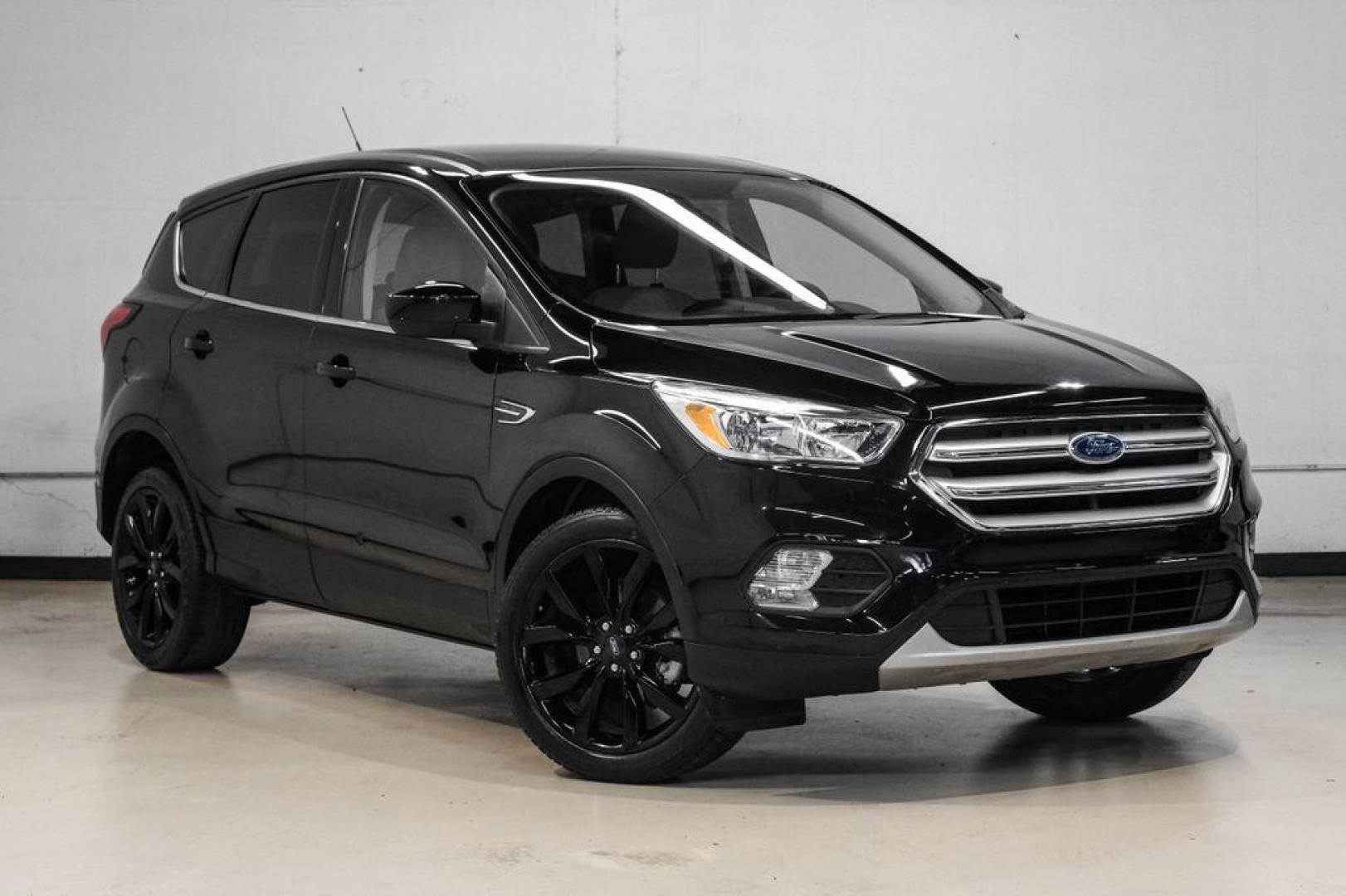2019 Black /Medium Light Stone Ford Escape SE (1FMCU0GD2KU) with an 1.5L EcoBoost engine, Automatic transmission, located at 15300 Midway Rd., Addison, TX, 75001, (972) 702-0011, 32.958321, -96.838074 - Photo#7