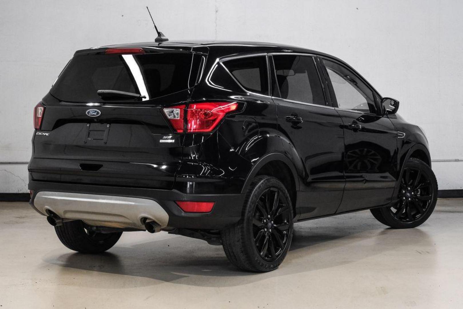 2019 Black /Medium Light Stone Ford Escape SE (1FMCU0GD2KU) with an 1.5L EcoBoost engine, Automatic transmission, located at 15300 Midway Rd., Addison, TX, 75001, (972) 702-0011, 32.958321, -96.838074 - Photo#9