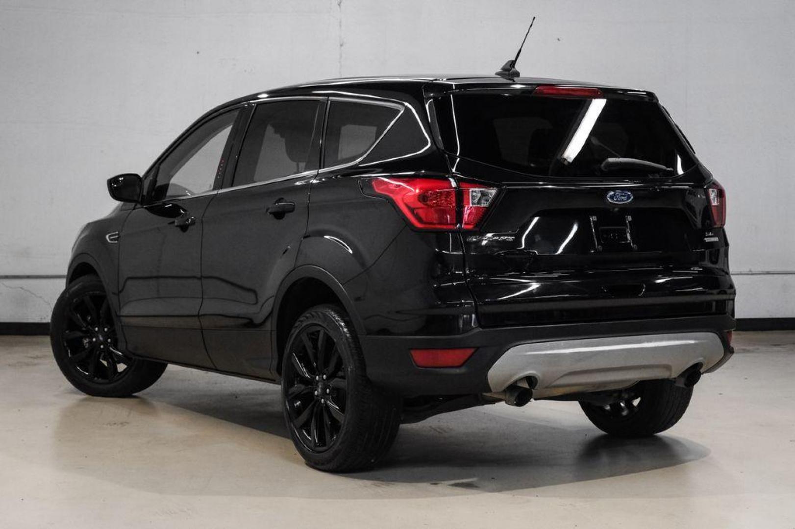 2019 Black /Medium Light Stone Ford Escape SE (1FMCU0GD2KU) with an 1.5L EcoBoost engine, Automatic transmission, located at 15300 Midway Rd., Addison, TX, 75001, (972) 702-0011, 32.958321, -96.838074 - Photo#11