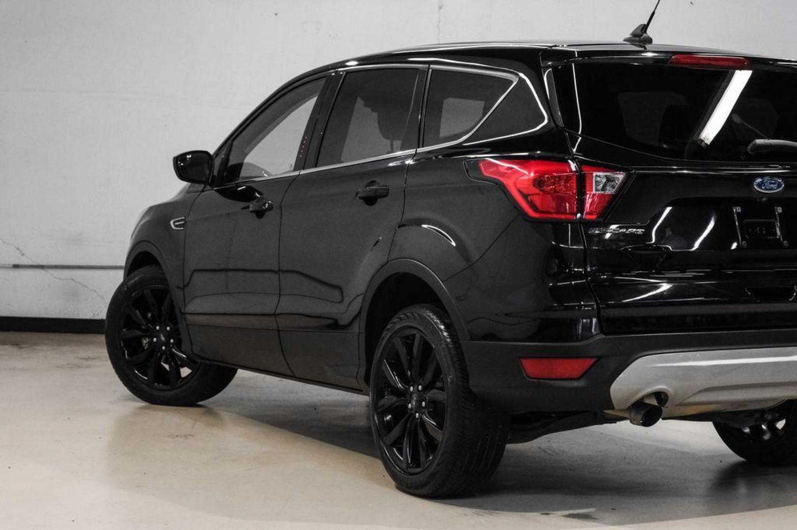 2019 Black /Medium Light Stone Ford Escape SE (1FMCU0GD2KU) with an 1.5L EcoBoost engine, Automatic transmission, located at 15300 Midway Rd., Addison, TX, 75001, (972) 702-0011, 32.958321, -96.838074 - Photo#12