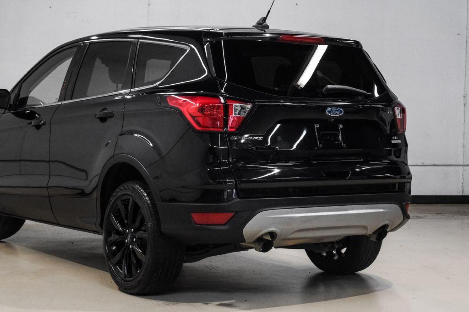 2019 Black /Medium Light Stone Ford Escape SE (1FMCU0GD2KU) with an 1.5L EcoBoost engine, Automatic transmission, located at 15300 Midway Rd., Addison, TX, 75001, (972) 702-0011, 32.958321, -96.838074 - Photo#13