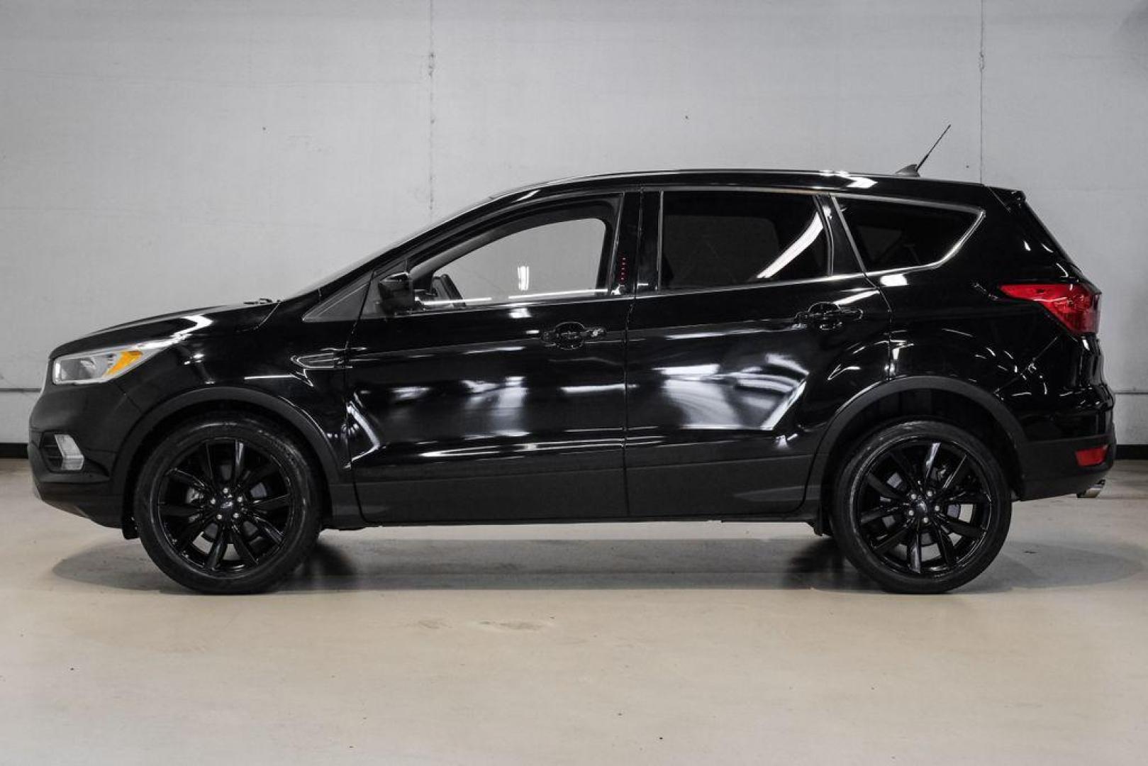 2019 Black /Medium Light Stone Ford Escape SE (1FMCU0GD2KU) with an 1.5L EcoBoost engine, Automatic transmission, located at 15300 Midway Rd., Addison, TX, 75001, (972) 702-0011, 32.958321, -96.838074 - Photo#14