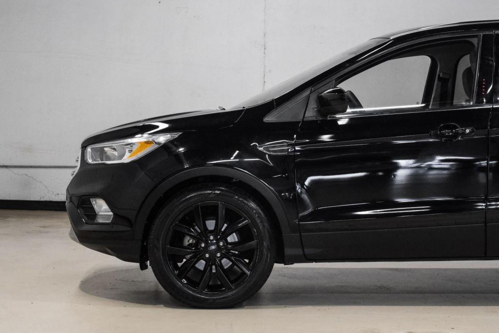 2019 Black /Medium Light Stone Ford Escape SE (1FMCU0GD2KU) with an 1.5L EcoBoost engine, Automatic transmission, located at 15300 Midway Rd., Addison, TX, 75001, (972) 702-0011, 32.958321, -96.838074 - Photo#15