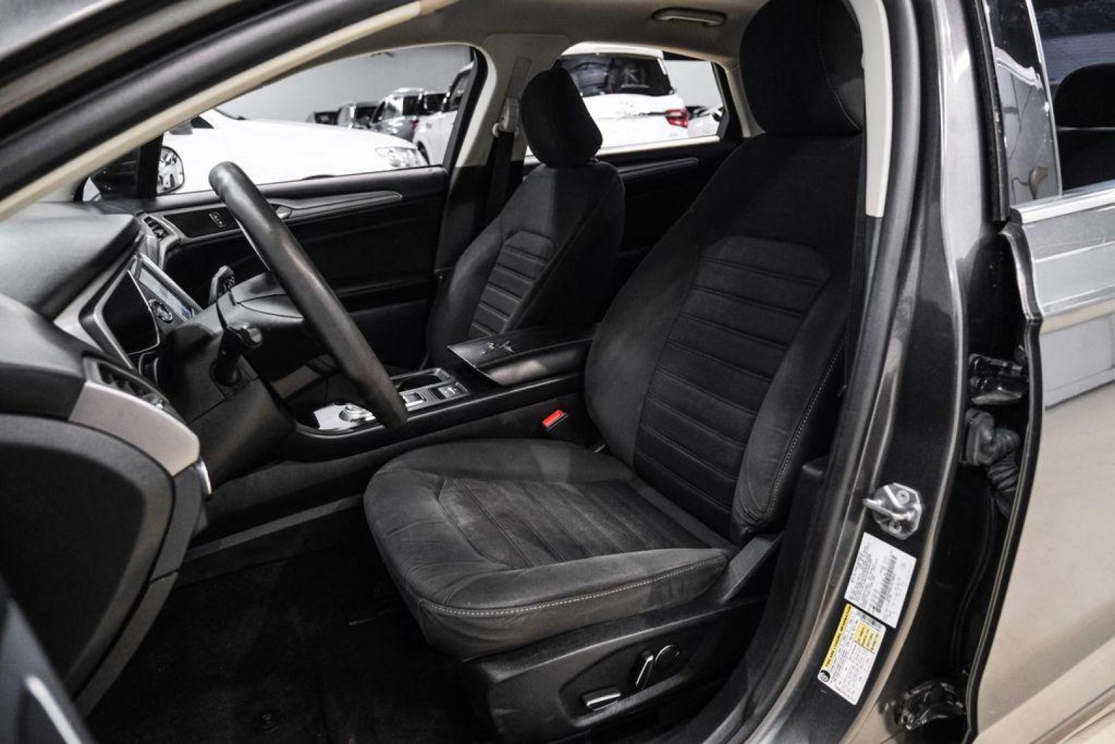 2020 Magnetic /Ebony Ford Fusion SE (3FA6P0HD5LR) with an 1.5L EcoBoost engine, Automatic transmission, located at 15300 Midway Rd., Addison, TX, 75001, (972) 702-0011, 32.958321, -96.838074 - Photo#26