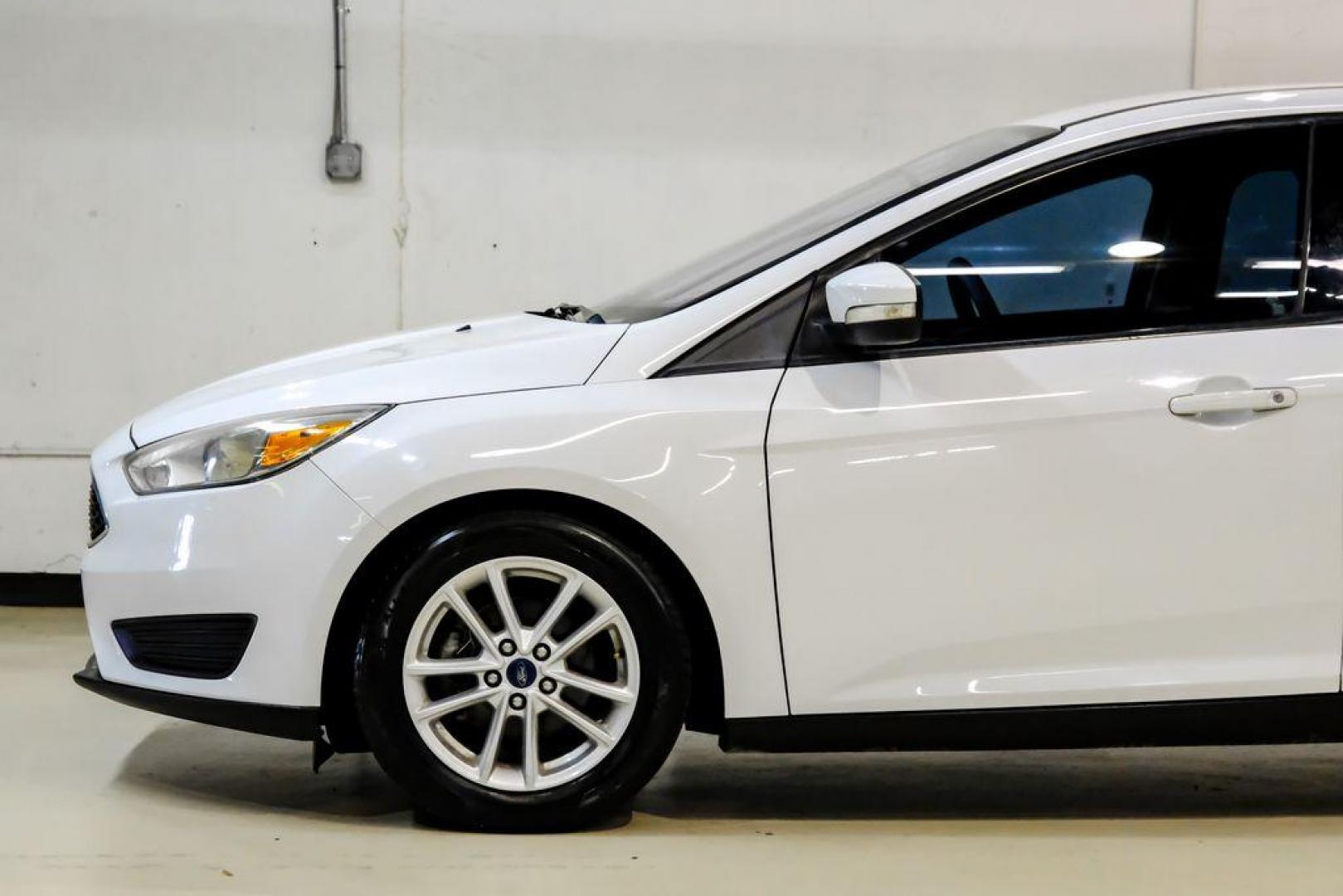 2017 Oxford White /Black Ford Focus SE (1FADP3F23HL) with an 2.0L 4-Cylinder DGI Flex Fuel Turbocharged DOHC engine, Automatic transmission, located at 15300 Midway Rd., Addison, TX, 75001, (972) 702-0011, 32.958321, -96.838074 - Photo#9