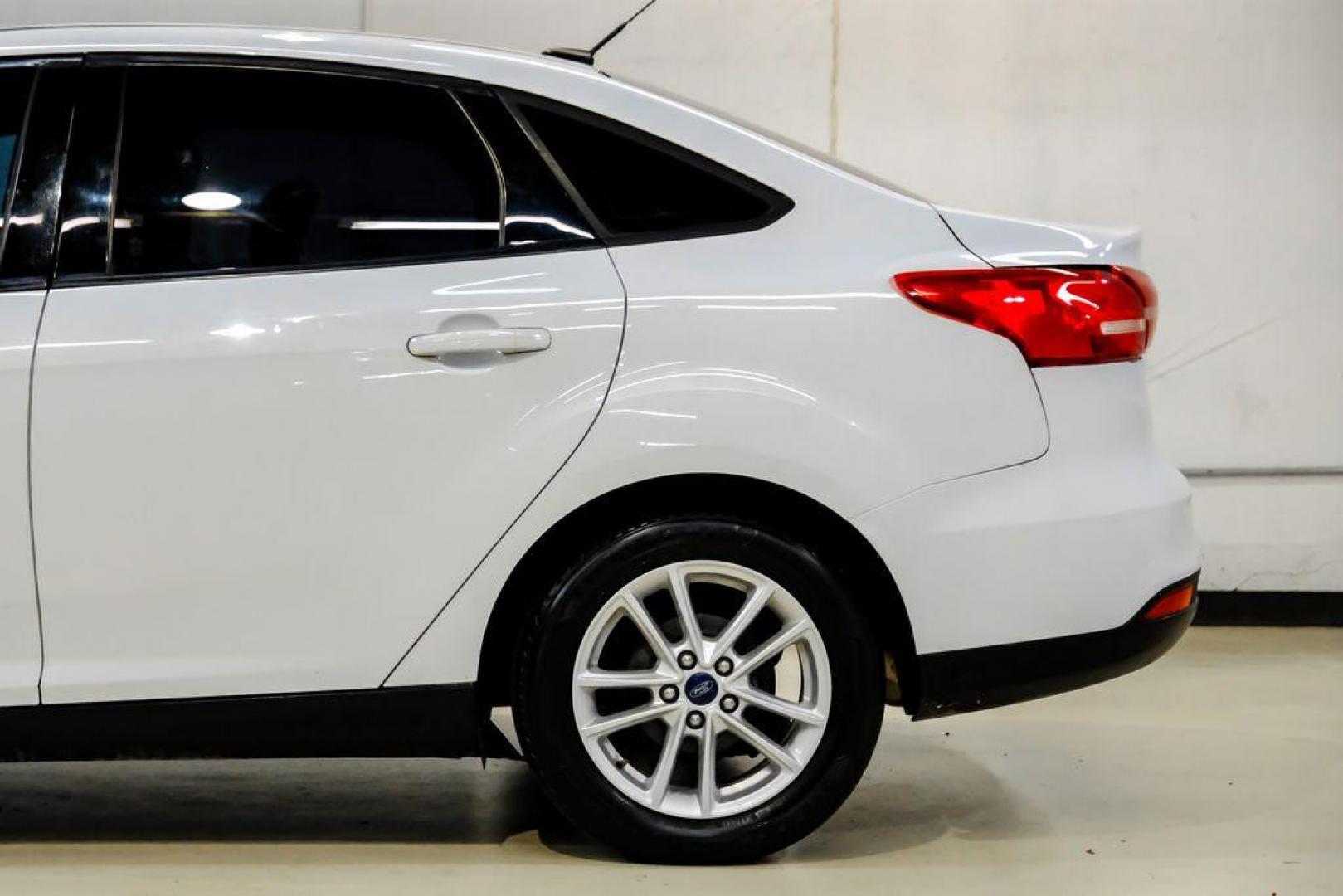 2017 Oxford White /Black Ford Focus SE (1FADP3F23HL) with an 2.0L 4-Cylinder DGI Flex Fuel Turbocharged DOHC engine, Automatic transmission, located at 15300 Midway Rd., Addison, TX, 75001, (972) 702-0011, 32.958321, -96.838074 - Photo#10