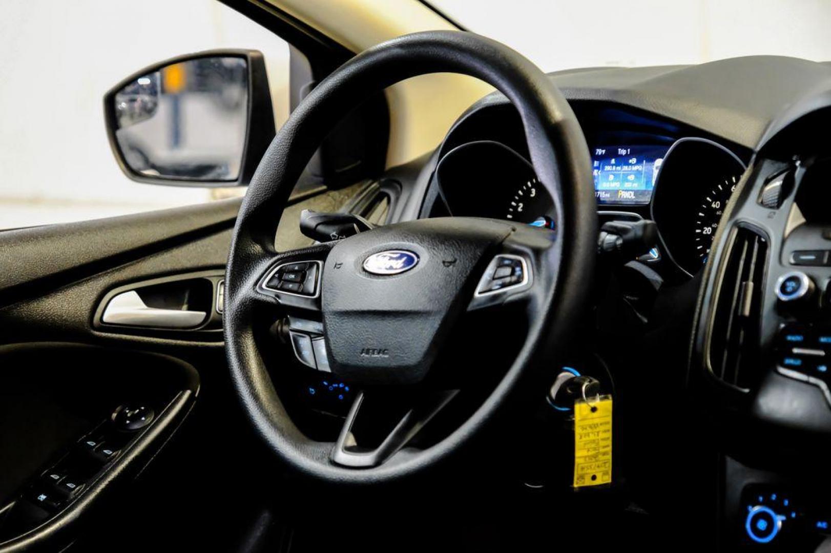 2017 Oxford White /Black Ford Focus SE (1FADP3F23HL) with an 2.0L 4-Cylinder DGI Flex Fuel Turbocharged DOHC engine, Automatic transmission, located at 15300 Midway Rd., Addison, TX, 75001, (972) 702-0011, 32.958321, -96.838074 - Photo#12