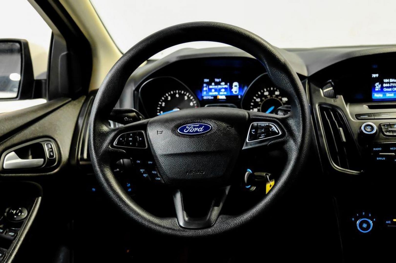 2017 Oxford White /Black Ford Focus SE (1FADP3F23HL) with an 2.0L 4-Cylinder DGI Flex Fuel Turbocharged DOHC engine, Automatic transmission, located at 15300 Midway Rd., Addison, TX, 75001, (972) 702-0011, 32.958321, -96.838074 - Photo#14