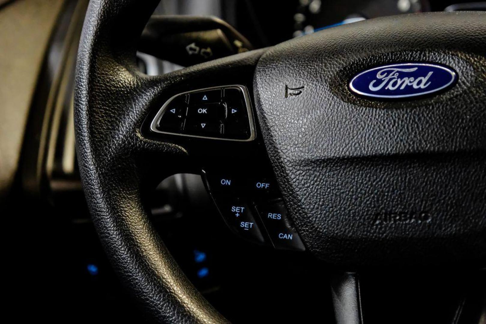 2017 Oxford White /Black Ford Focus SE (1FADP3F23HL) with an 2.0L 4-Cylinder DGI Flex Fuel Turbocharged DOHC engine, Automatic transmission, located at 15300 Midway Rd., Addison, TX, 75001, (972) 702-0011, 32.958321, -96.838074 - Photo#15