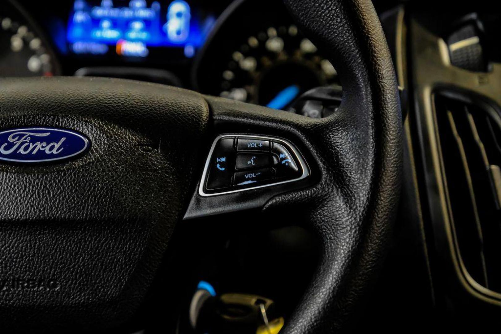 2017 Oxford White /Black Ford Focus SE (1FADP3F23HL) with an 2.0L 4-Cylinder DGI Flex Fuel Turbocharged DOHC engine, Automatic transmission, located at 15300 Midway Rd., Addison, TX, 75001, (972) 702-0011, 32.958321, -96.838074 - Photo#16