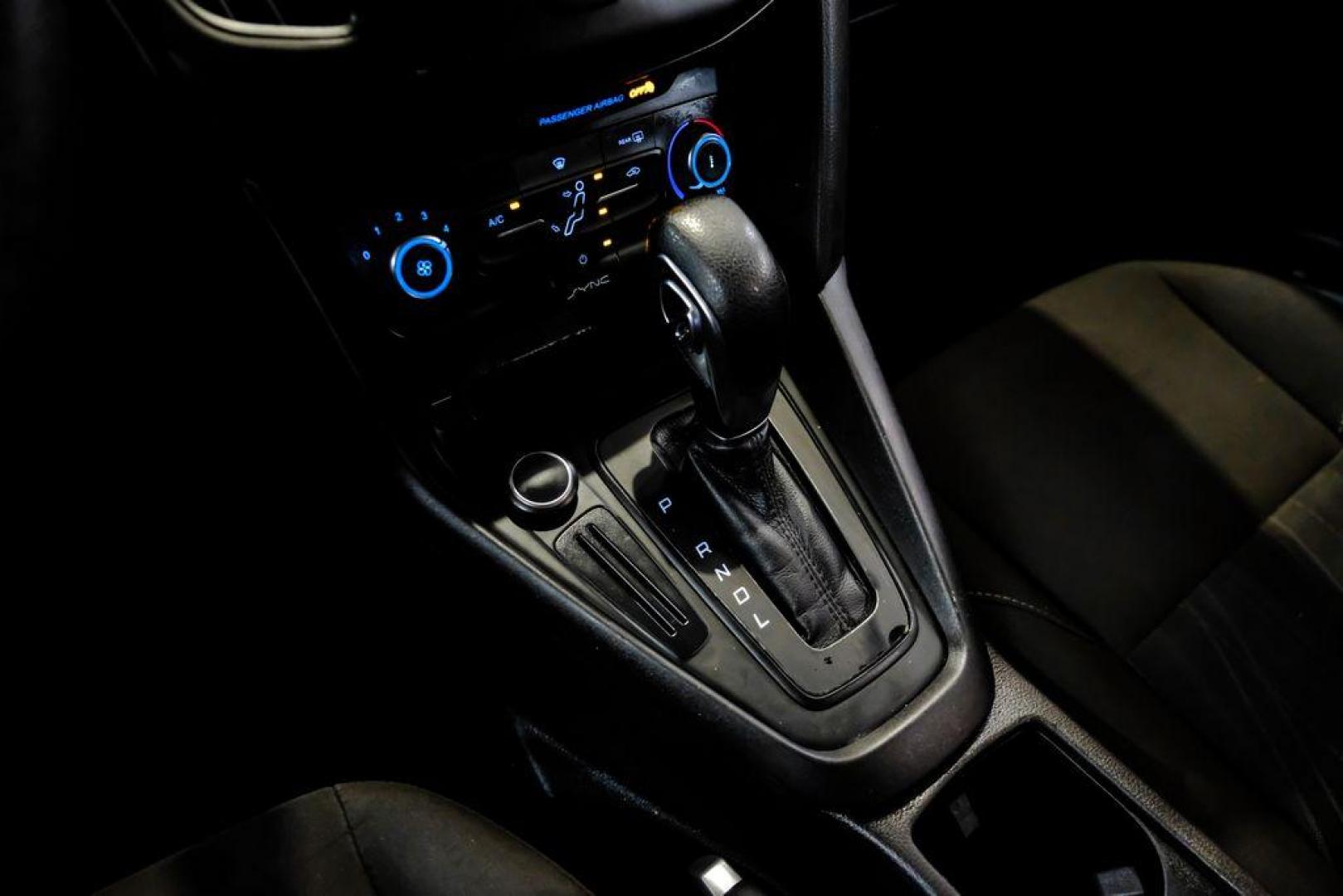 2017 Oxford White /Black Ford Focus SE (1FADP3F23HL) with an 2.0L 4-Cylinder DGI Flex Fuel Turbocharged DOHC engine, Automatic transmission, located at 15300 Midway Rd., Addison, TX, 75001, (972) 702-0011, 32.958321, -96.838074 - Photo#20