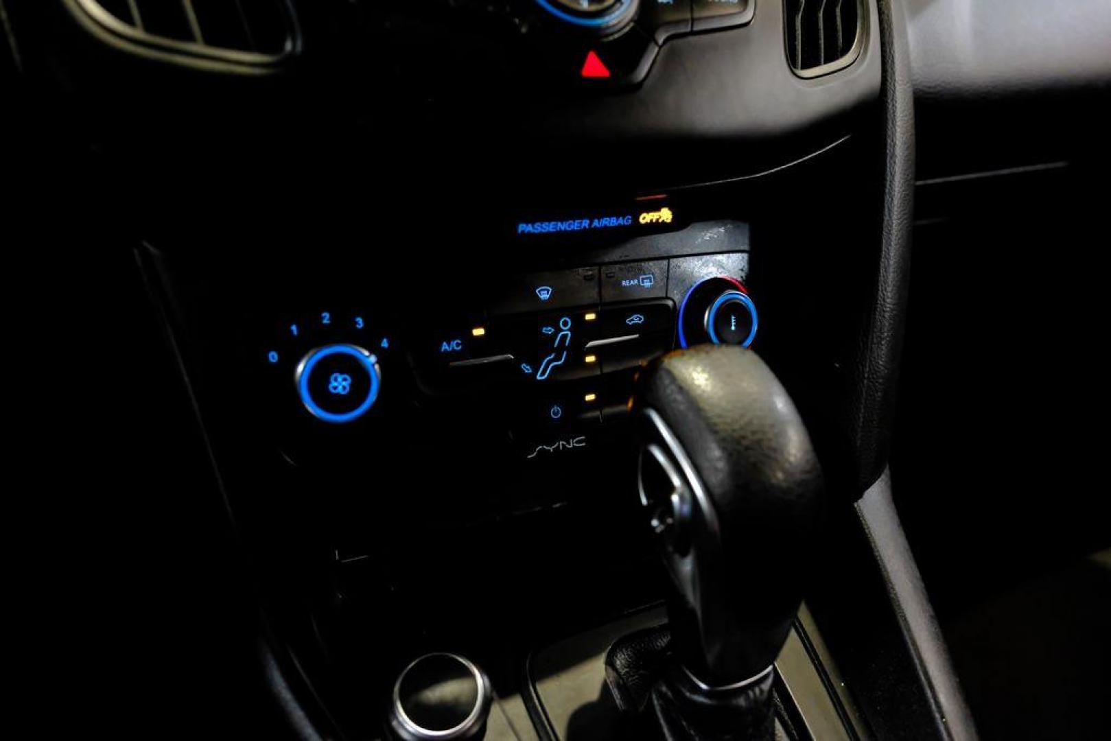 2017 Oxford White /Black Ford Focus SE (1FADP3F23HL) with an 2.0L 4-Cylinder DGI Flex Fuel Turbocharged DOHC engine, Automatic transmission, located at 15300 Midway Rd., Addison, TX, 75001, (972) 702-0011, 32.958321, -96.838074 - Photo#21