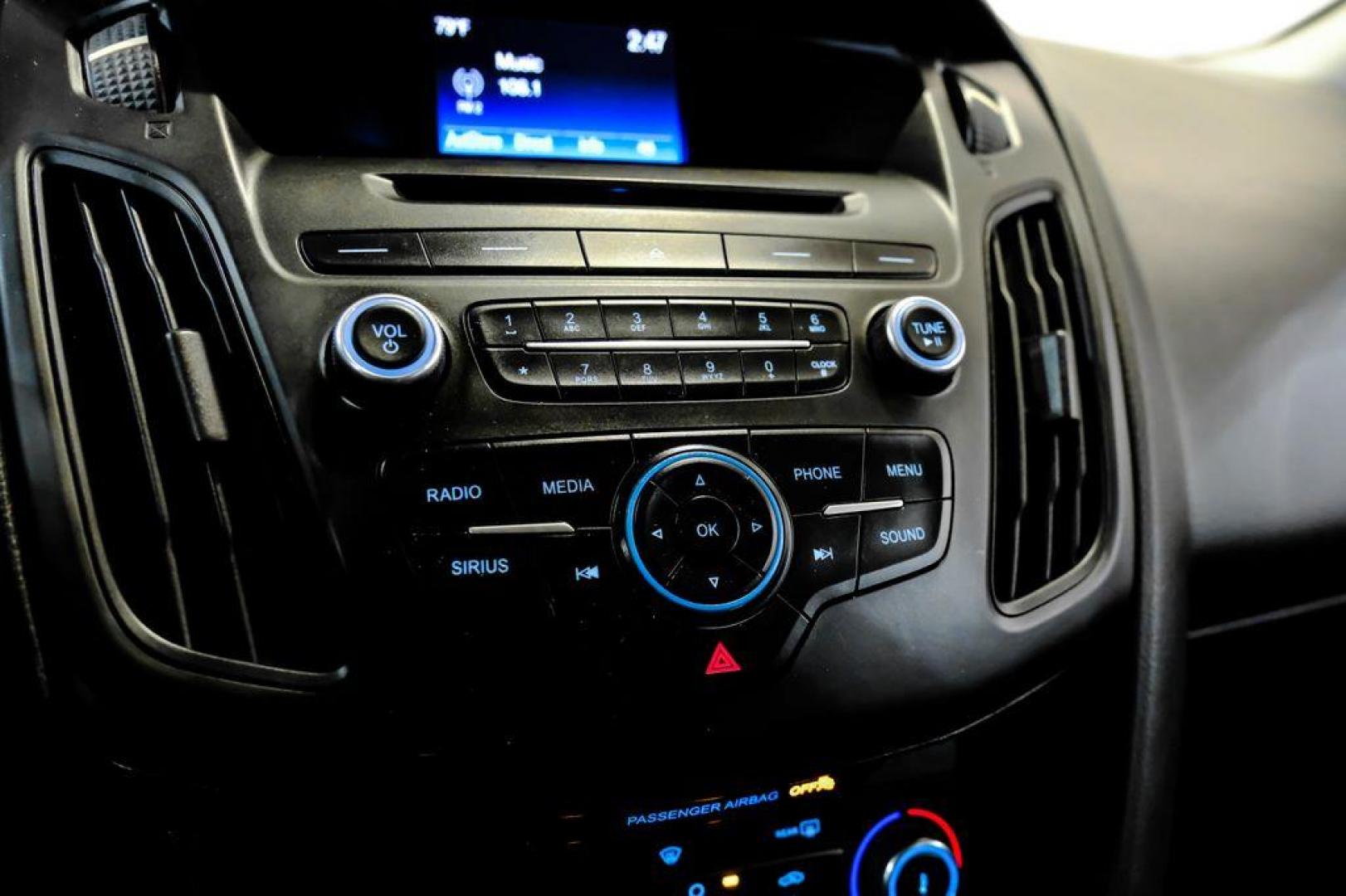 2017 Oxford White /Black Ford Focus SE (1FADP3F23HL) with an 2.0L 4-Cylinder DGI Flex Fuel Turbocharged DOHC engine, Automatic transmission, located at 15300 Midway Rd., Addison, TX, 75001, (972) 702-0011, 32.958321, -96.838074 - Photo#22