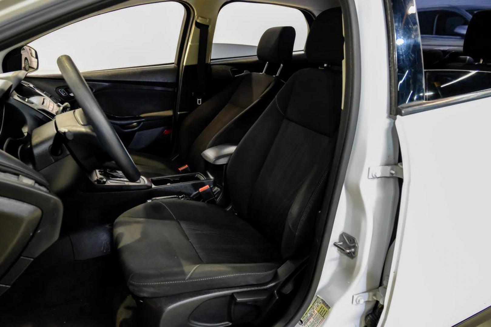 2017 Oxford White /Black Ford Focus SE (1FADP3F23HL) with an 2.0L 4-Cylinder DGI Flex Fuel Turbocharged DOHC engine, Automatic transmission, located at 15300 Midway Rd., Addison, TX, 75001, (972) 702-0011, 32.958321, -96.838074 - Photo#28