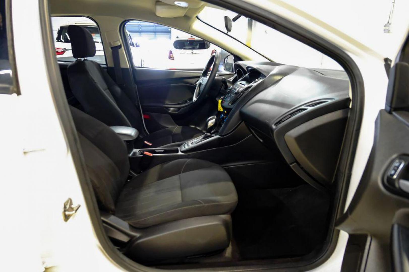 2017 Oxford White /Black Ford Focus SE (1FADP3F23HL) with an 2.0L 4-Cylinder DGI Flex Fuel Turbocharged DOHC engine, Automatic transmission, located at 15300 Midway Rd., Addison, TX, 75001, (972) 702-0011, 32.958321, -96.838074 - Photo#29