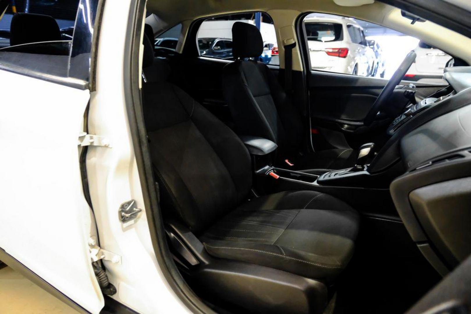 2017 Oxford White /Black Ford Focus SE (1FADP3F23HL) with an 2.0L 4-Cylinder DGI Flex Fuel Turbocharged DOHC engine, Automatic transmission, located at 15300 Midway Rd., Addison, TX, 75001, (972) 702-0011, 32.958321, -96.838074 - Photo#30