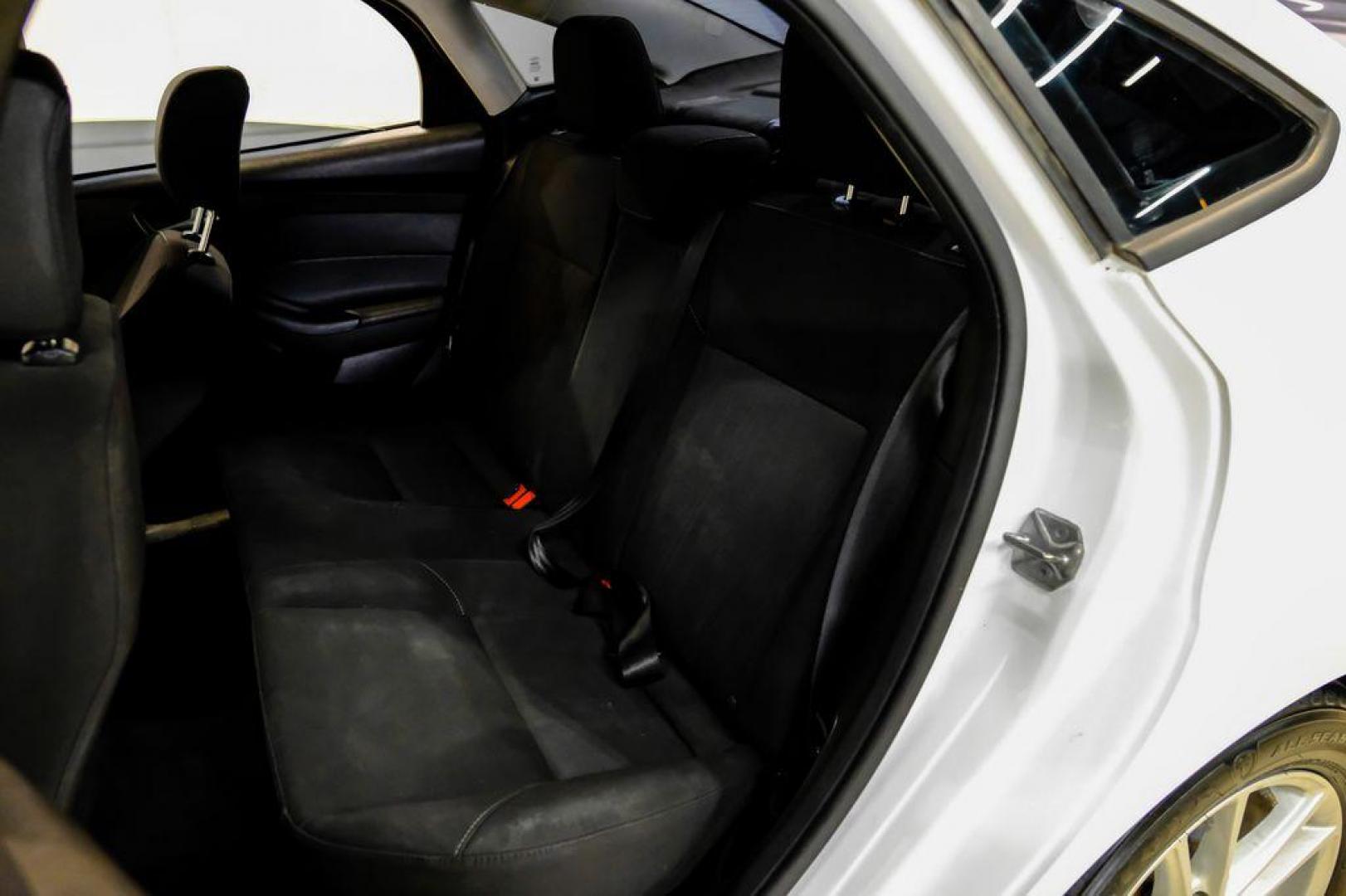 2017 Oxford White /Black Ford Focus SE (1FADP3F23HL) with an 2.0L 4-Cylinder DGI Flex Fuel Turbocharged DOHC engine, Automatic transmission, located at 15300 Midway Rd., Addison, TX, 75001, (972) 702-0011, 32.958321, -96.838074 - Photo#34